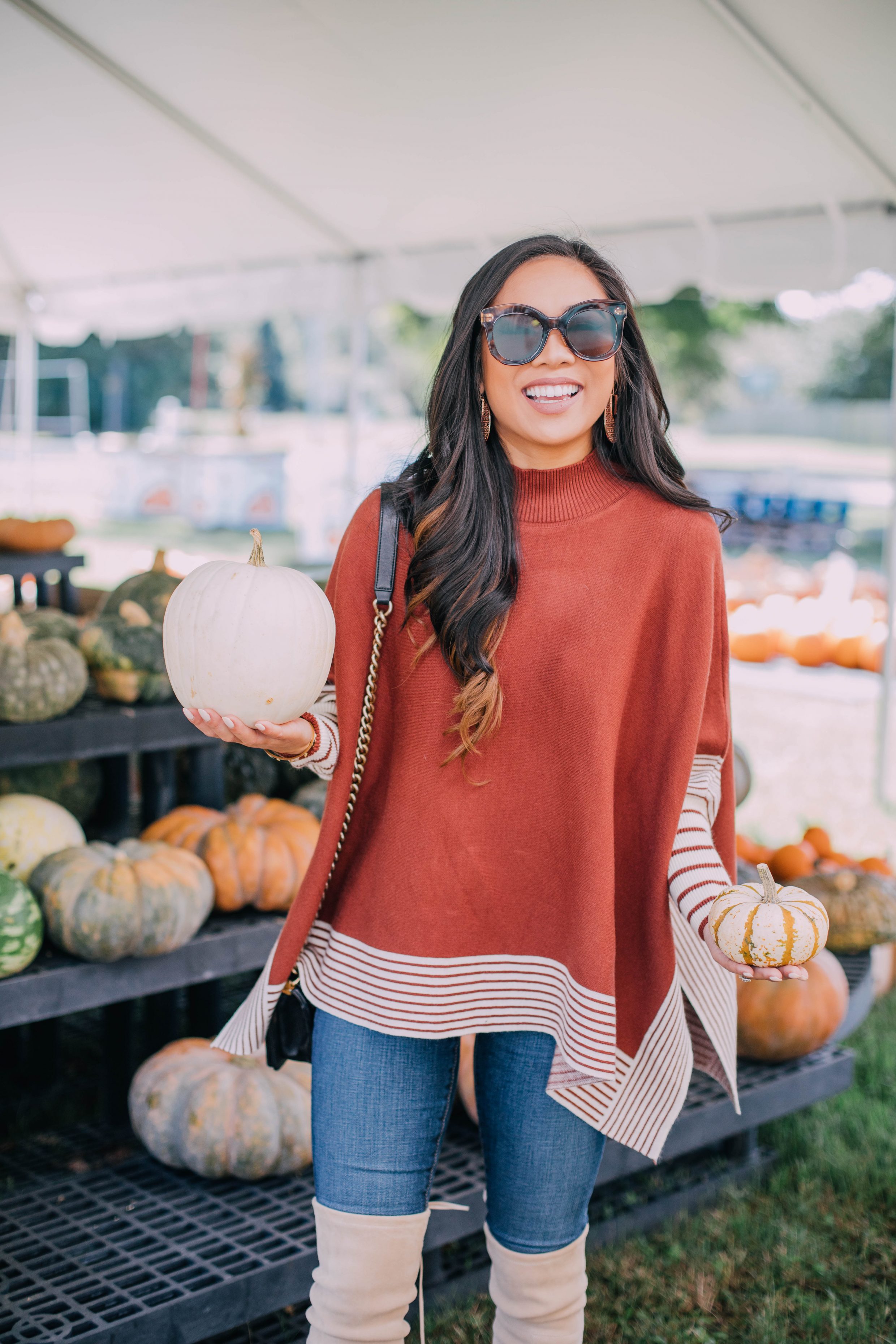 Blogger Hoang-Kim wears a caramel cape sweater from Chicwish for fall