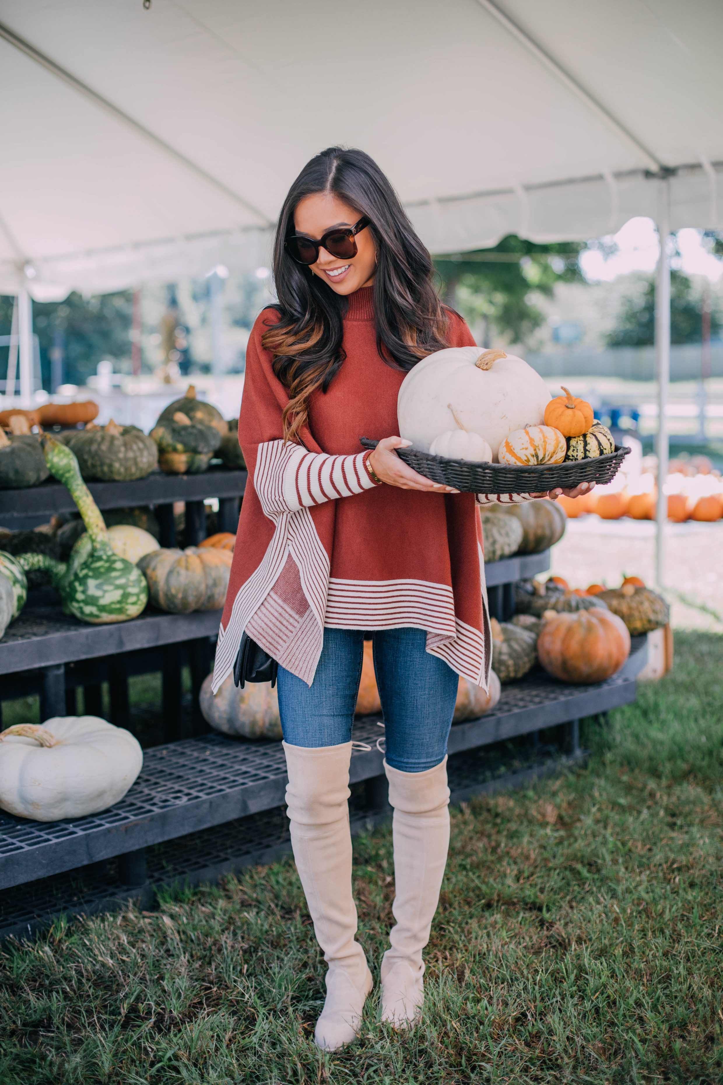 Blogger Hoang-Kim wears a cape sweater to visit Hunt Club Farm