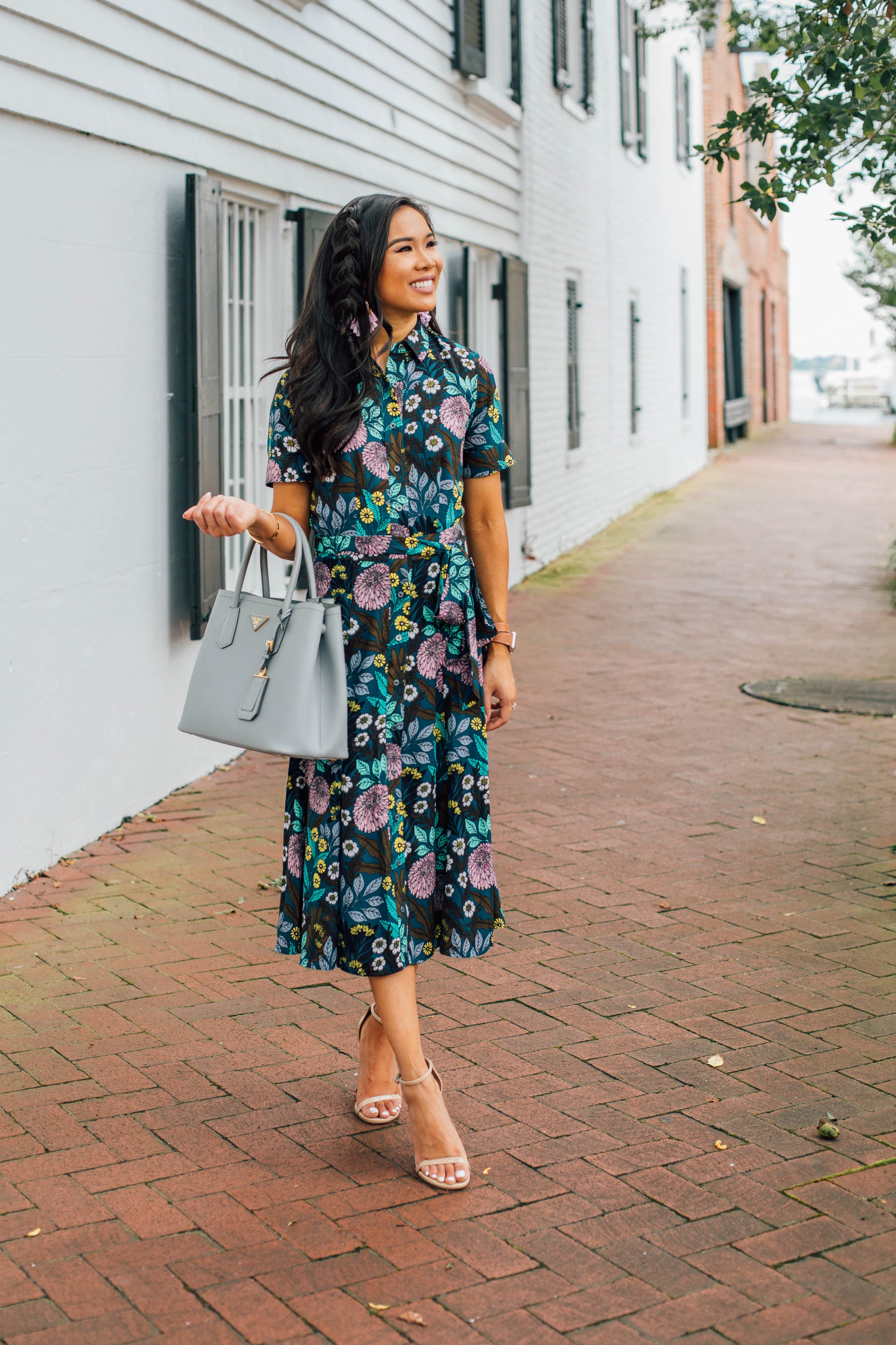 Blogger Hoang-Kim wears a floral dress for fall with a loose braid