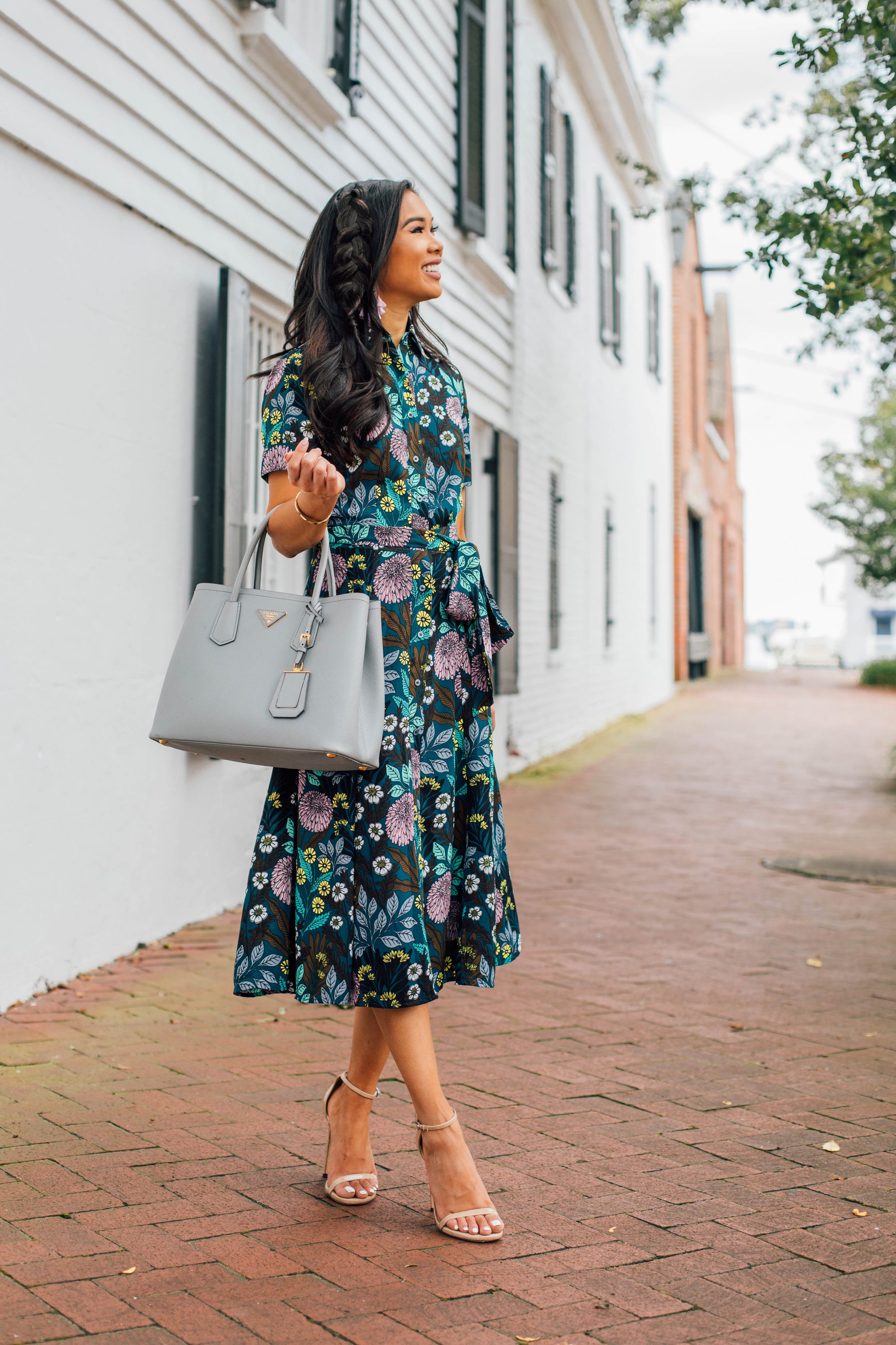 Blogger Hoang-Kim wears a floral transition dress for fall with pockets