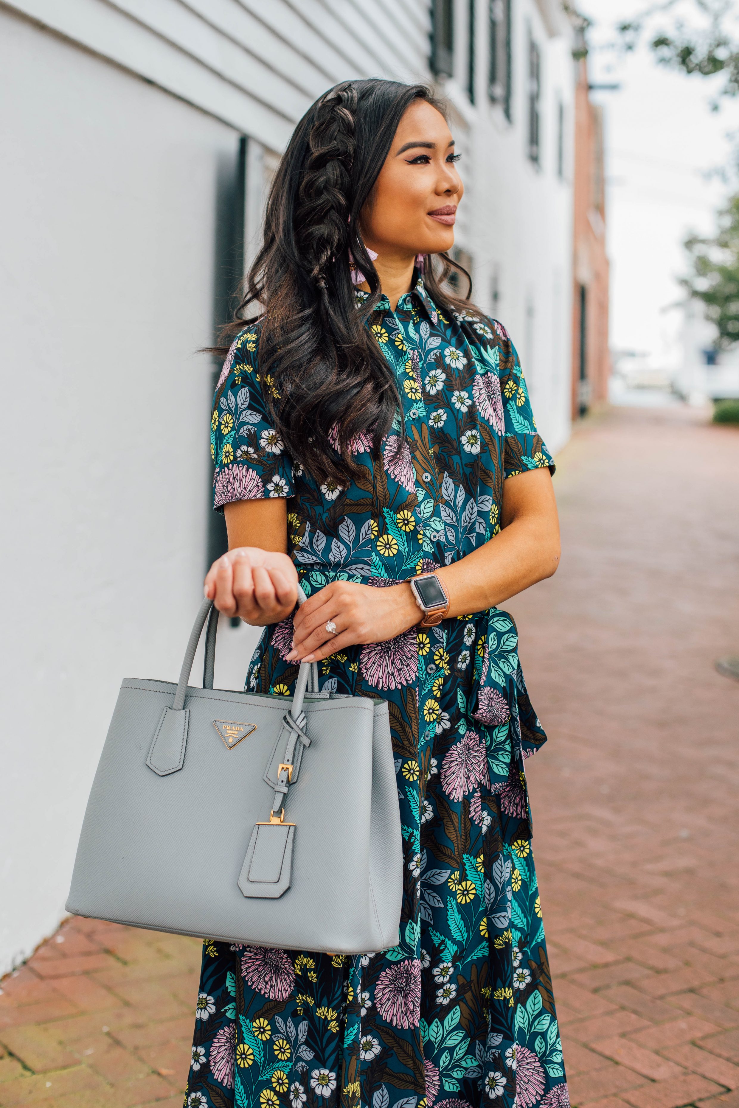 Blogger Hoang-Kim wears a floral transition dress for summer into fall with a loose braid hairstyle
