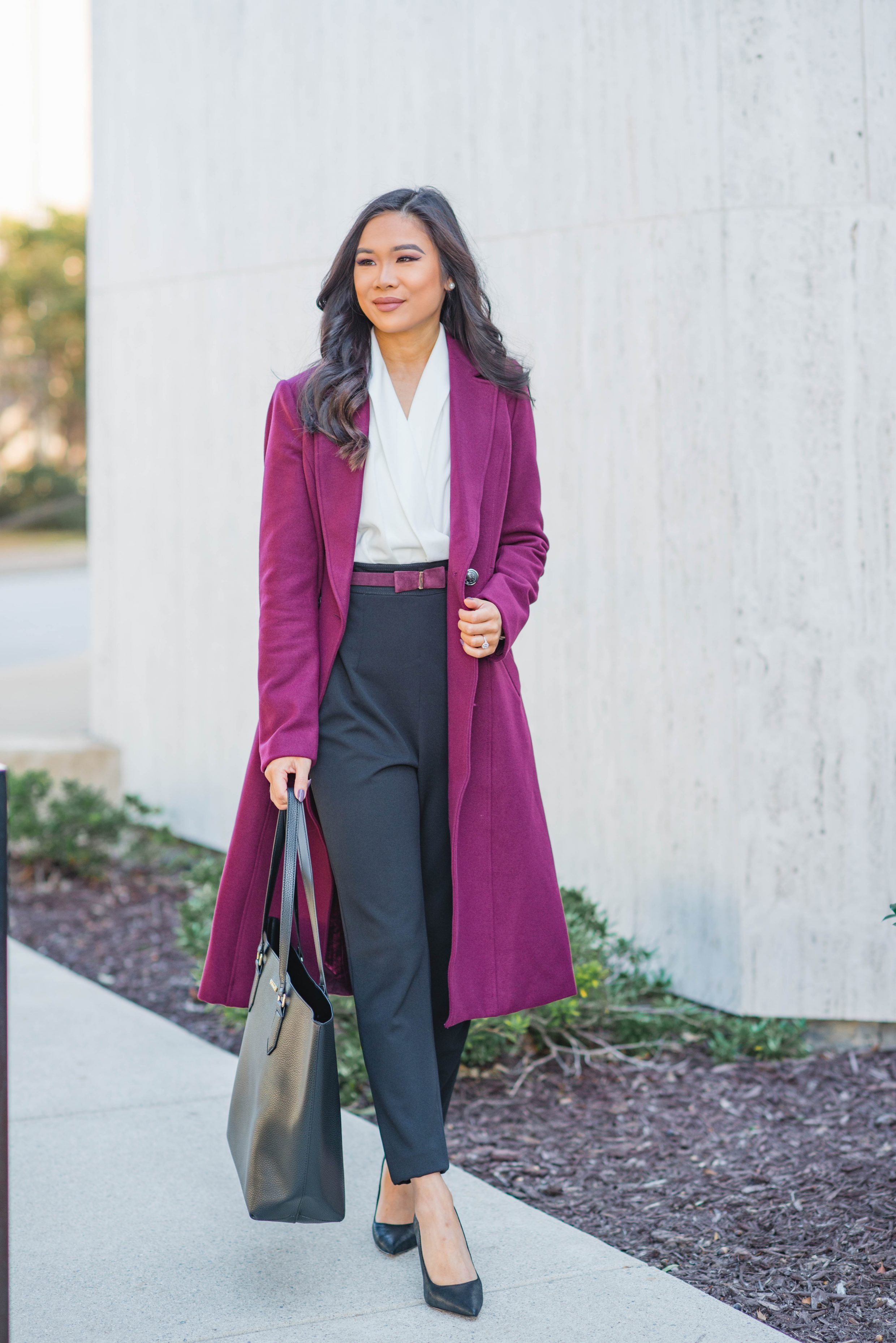 Hoang-Kim wears a contrast jumpsuit with a burgundy coat from desk to drinks