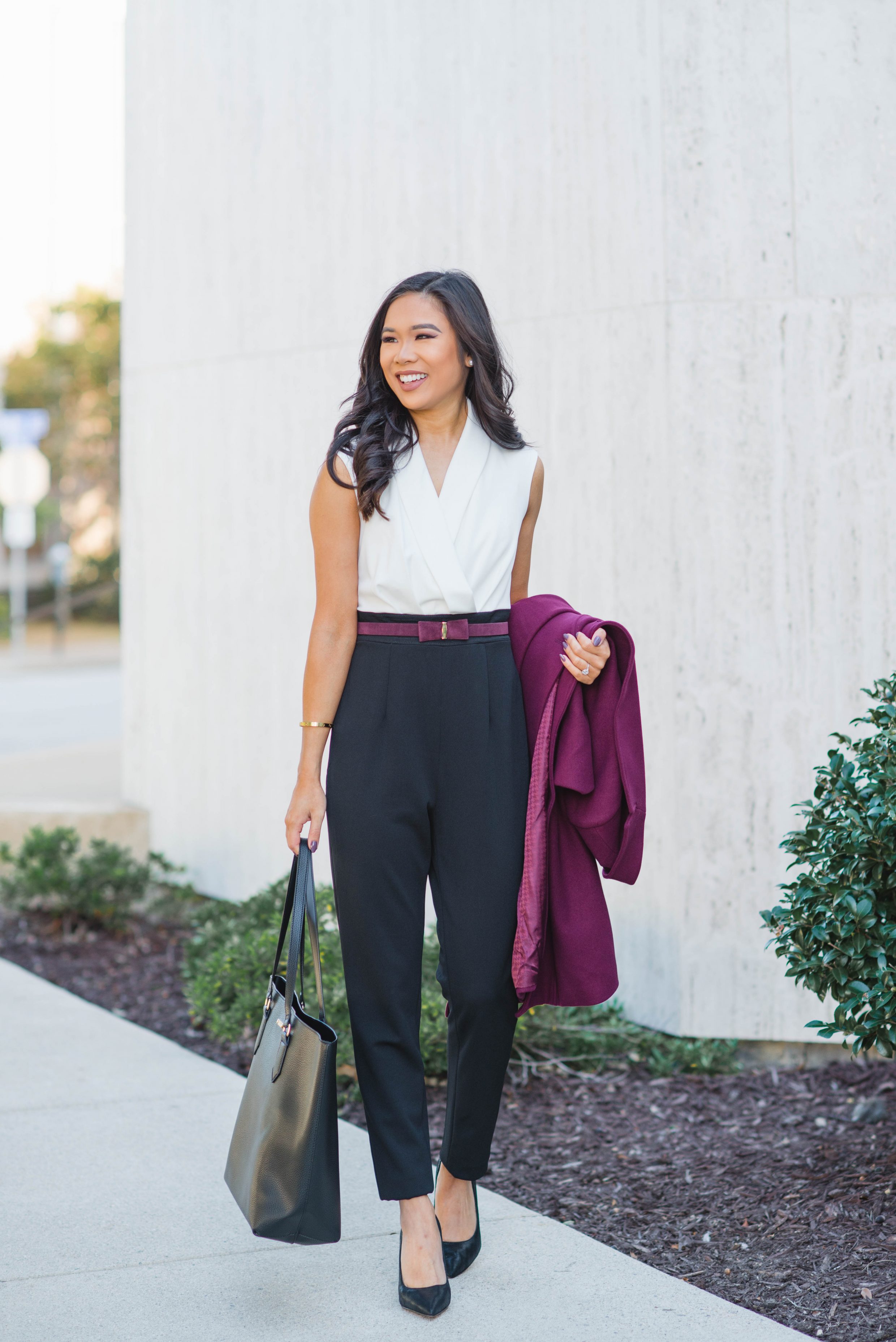 Hoang-Kim wears a contrast jumpsuit perfect for work and cocktail parties in the fall