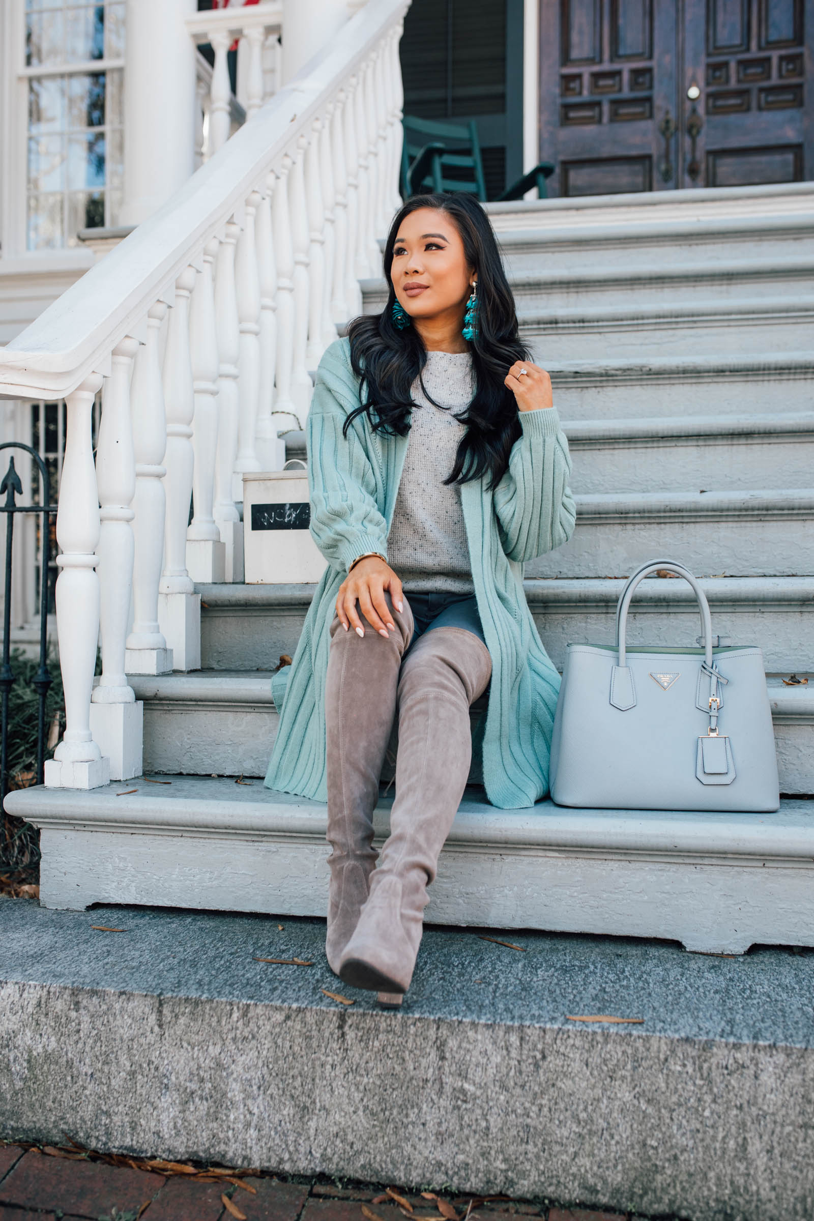 Blogger Hoang-Kim wears a mint green cardigan for fall 