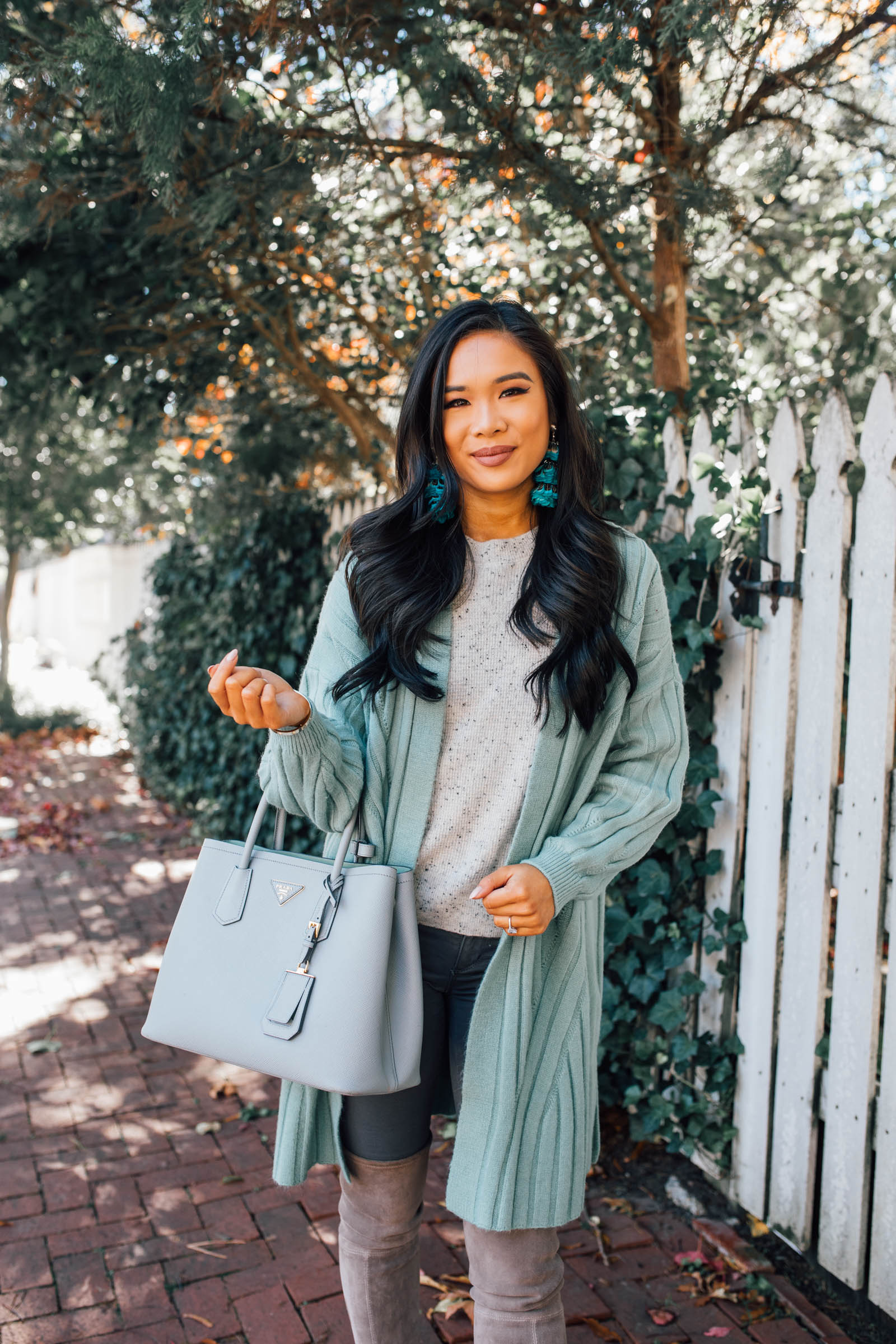 Blogger Hoang-Kim shares how to style a mint green cardigan for a fall ootd