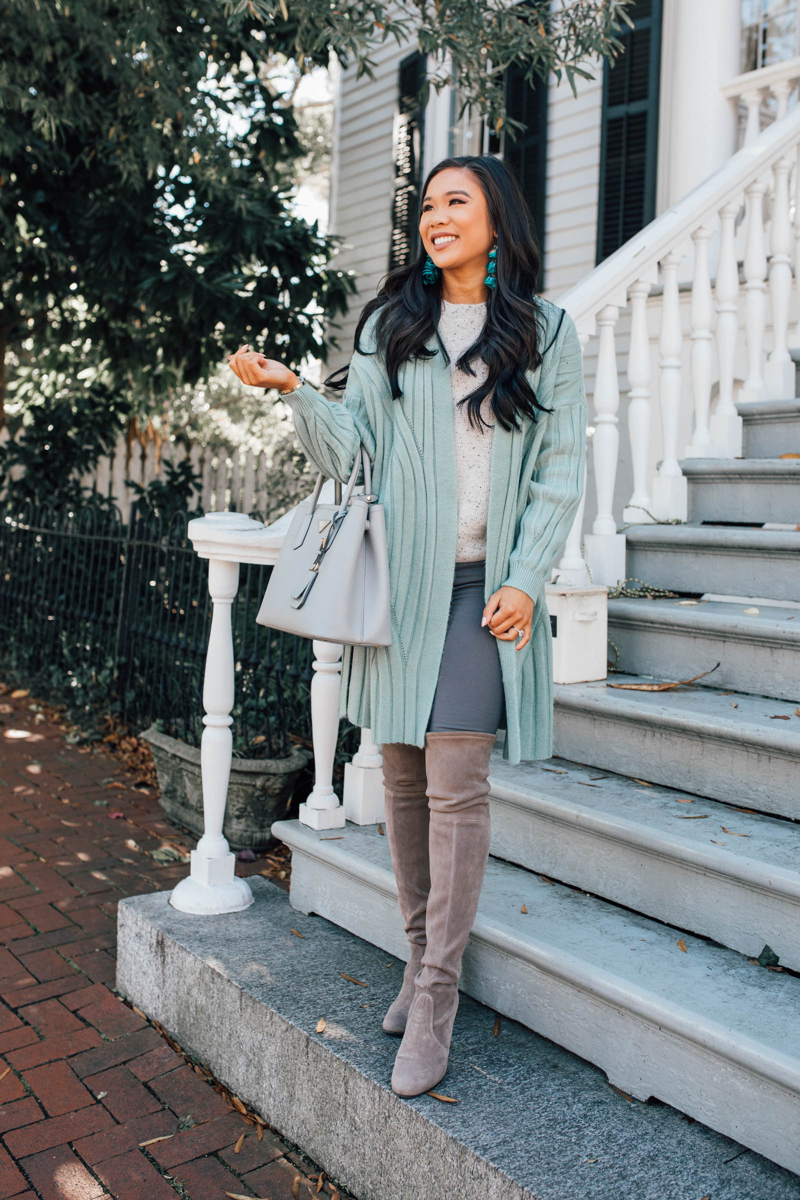Blogger Hoang-Kim shares how to style a mint green cardigan with over-the-knee boots