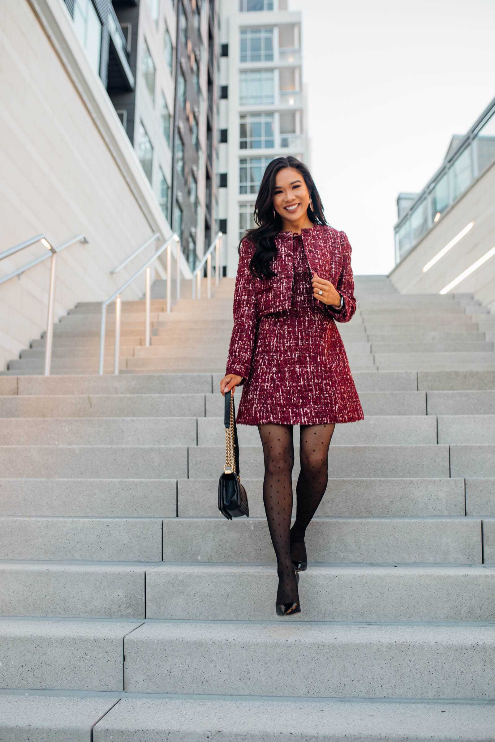 Blogger Hoang-Kim shares an office holiday party outfit idea wearing a matching tweed dress and jacket