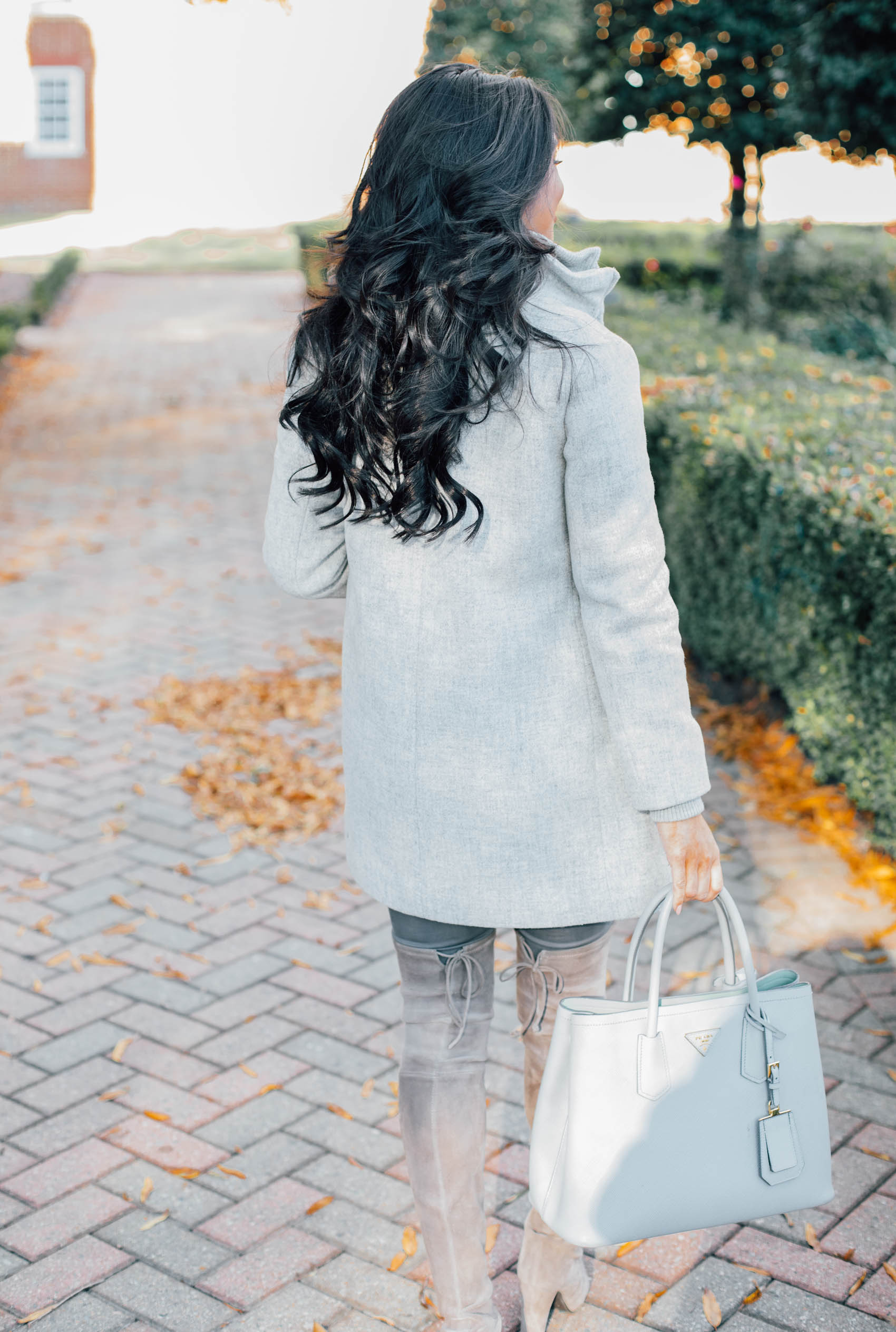 Blogger Hoang-Kim wears a gray wool coat perfect for petite women