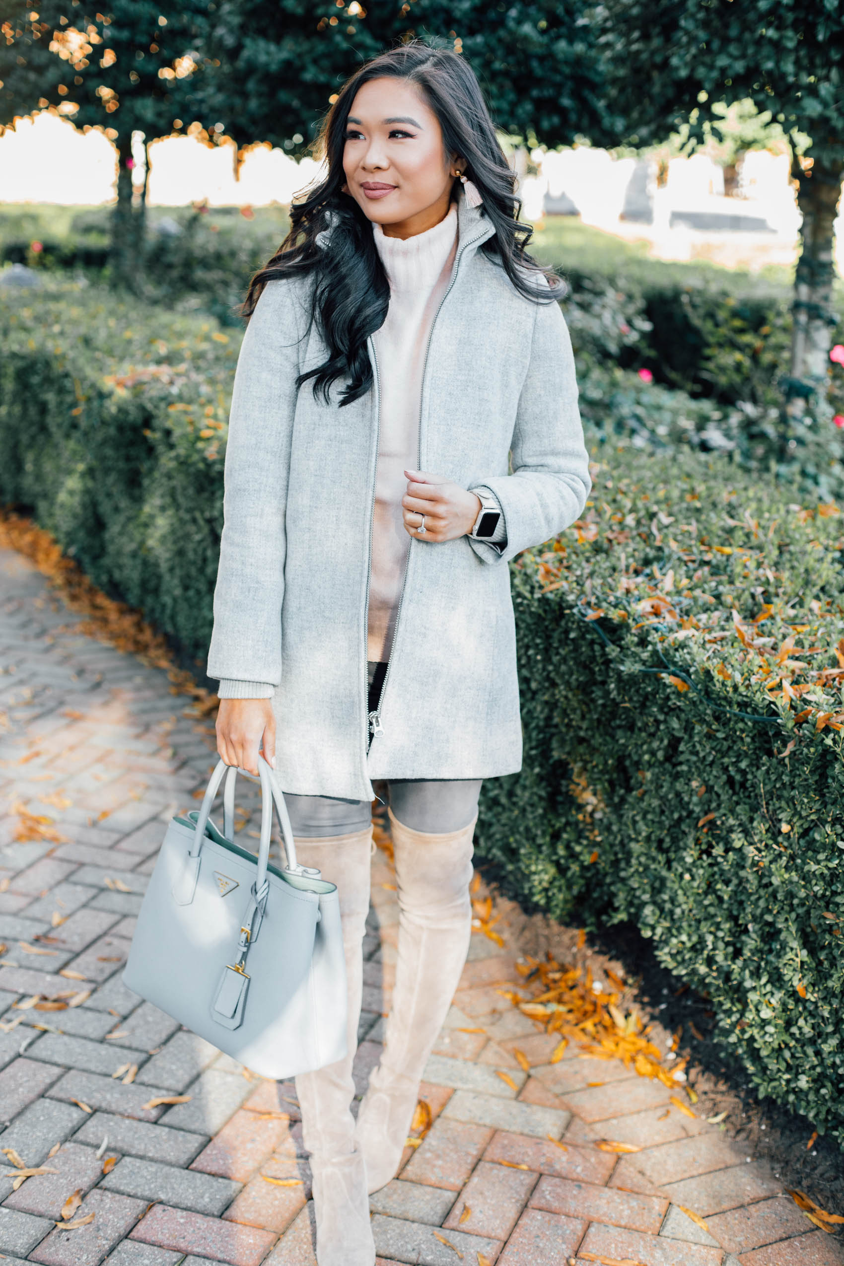 Blogger Hoang-Kim wears a wool winter coat perfect for petites