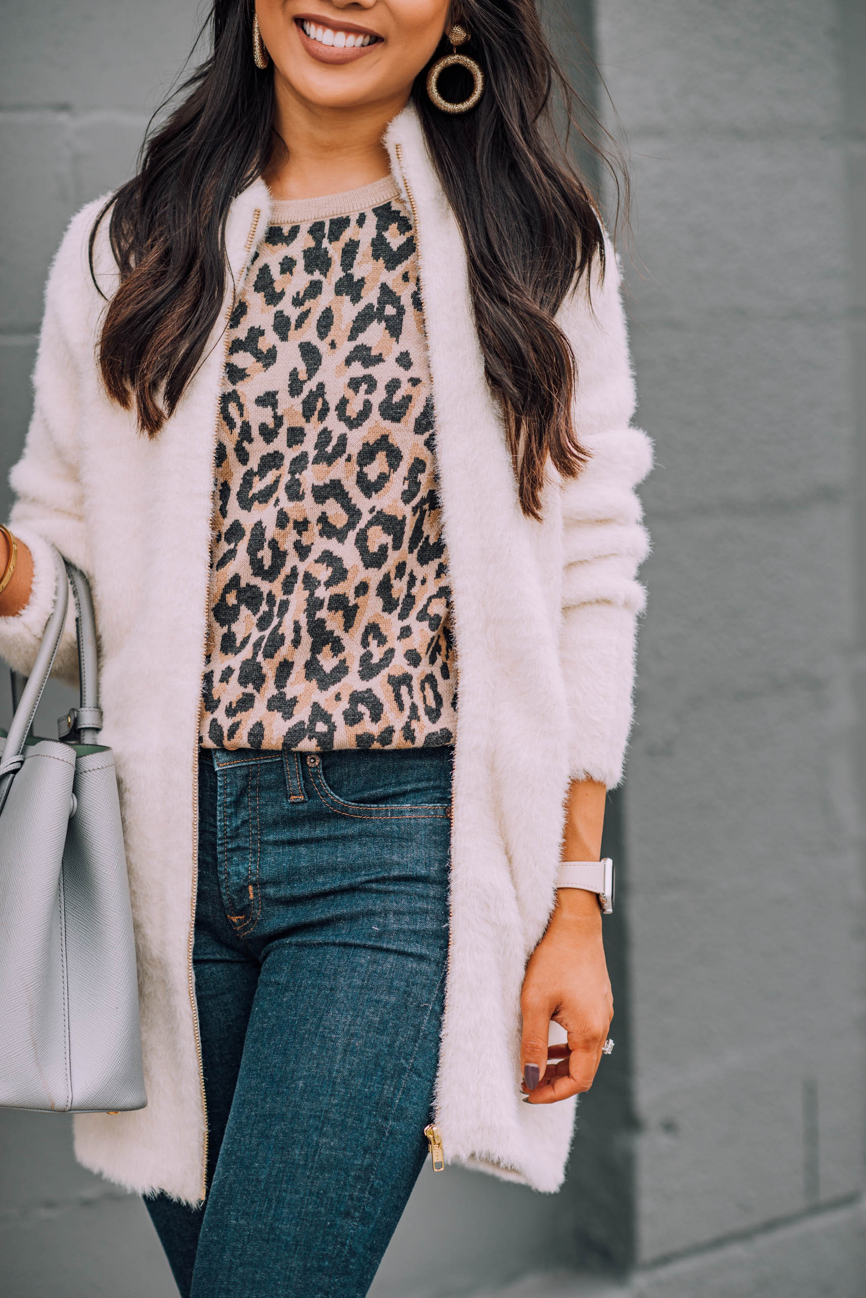 Blogger Hoang-Kim wears a fuzzy cardigan jacket with a leopard print sweatshirt for fall