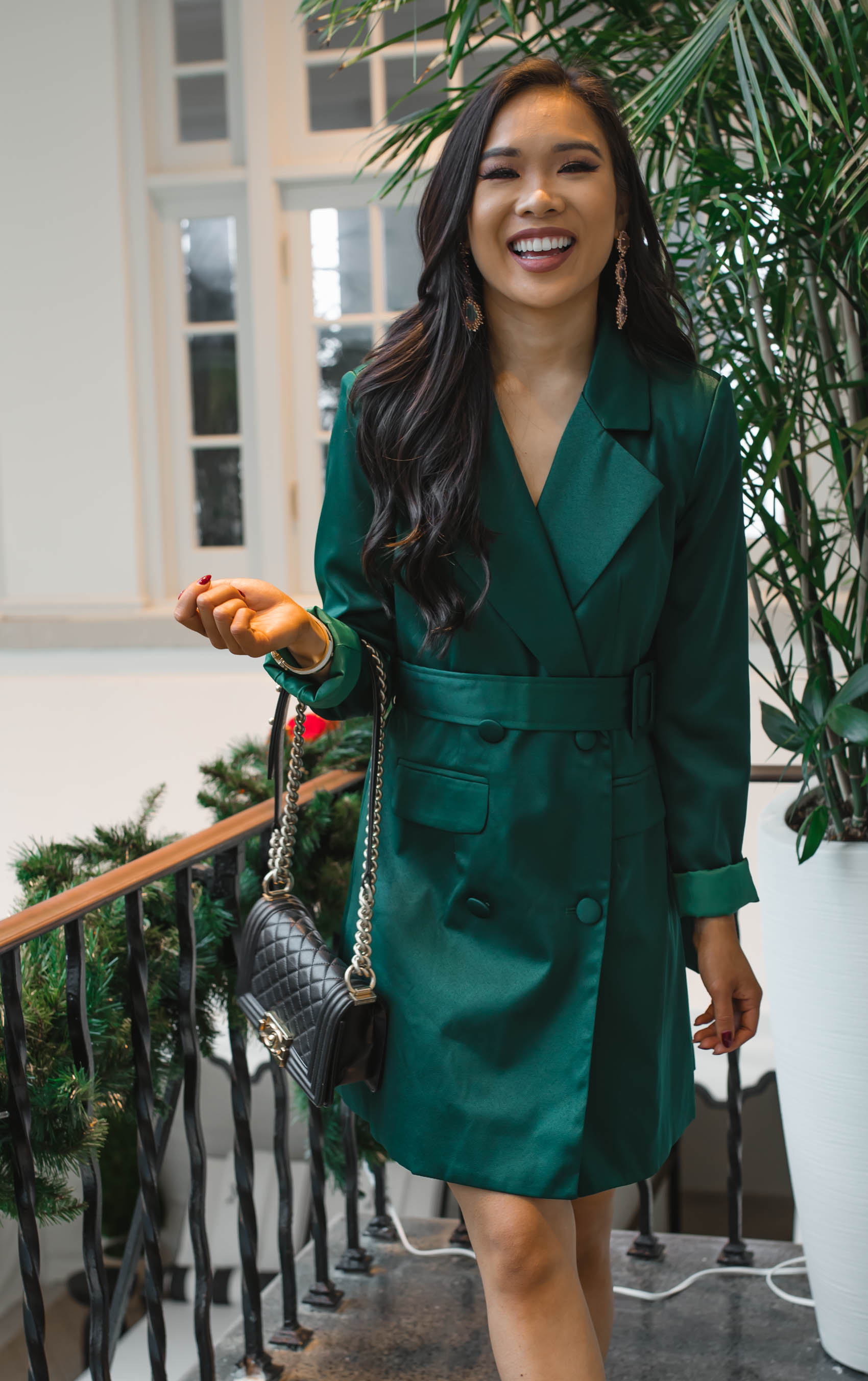 Blogger Hoang-Kim wears a green blazer dress and Kendra Scott earrings