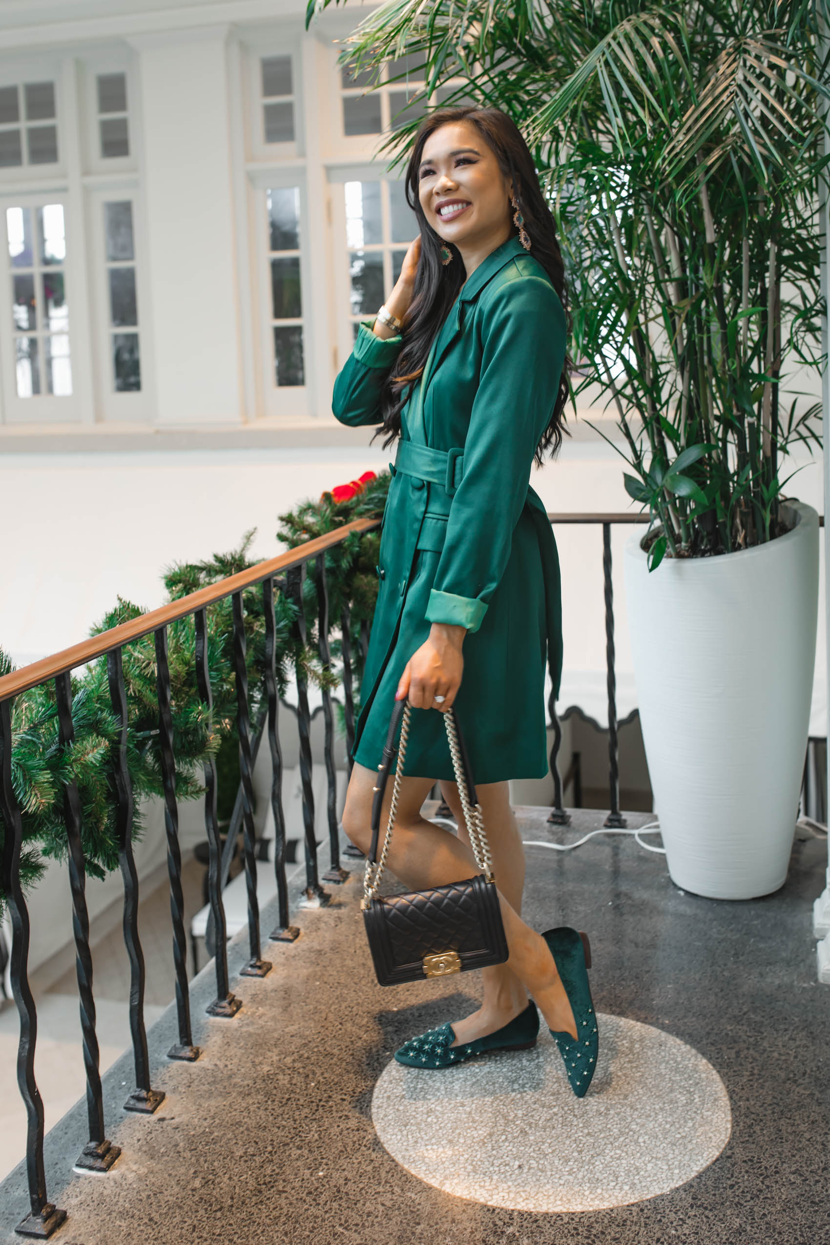Blogger Hoang-Kim wearing velvet flats with a green blazer dress