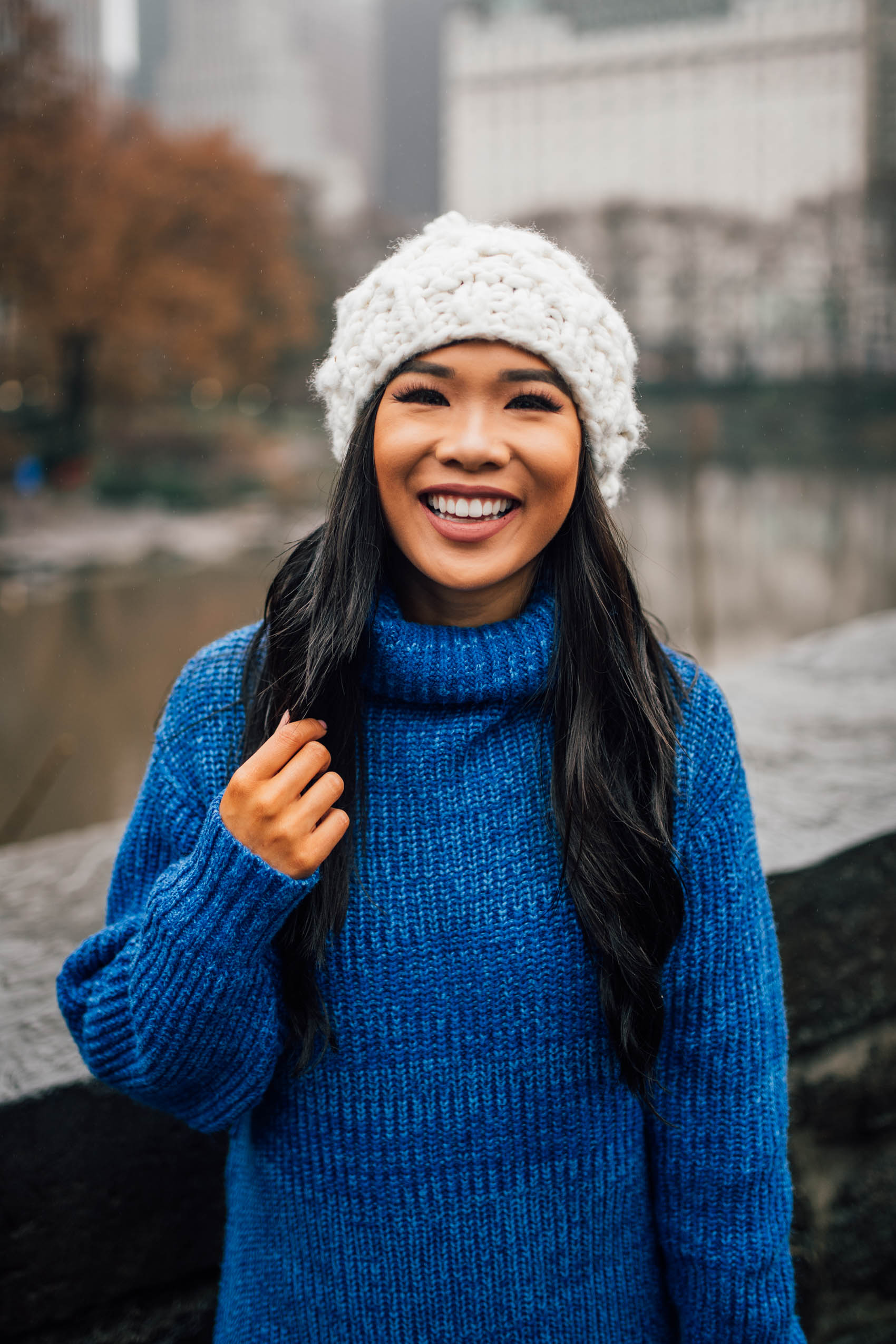 Blogger Hoang-Kim wearing a chunky knit beanie from Sole Society