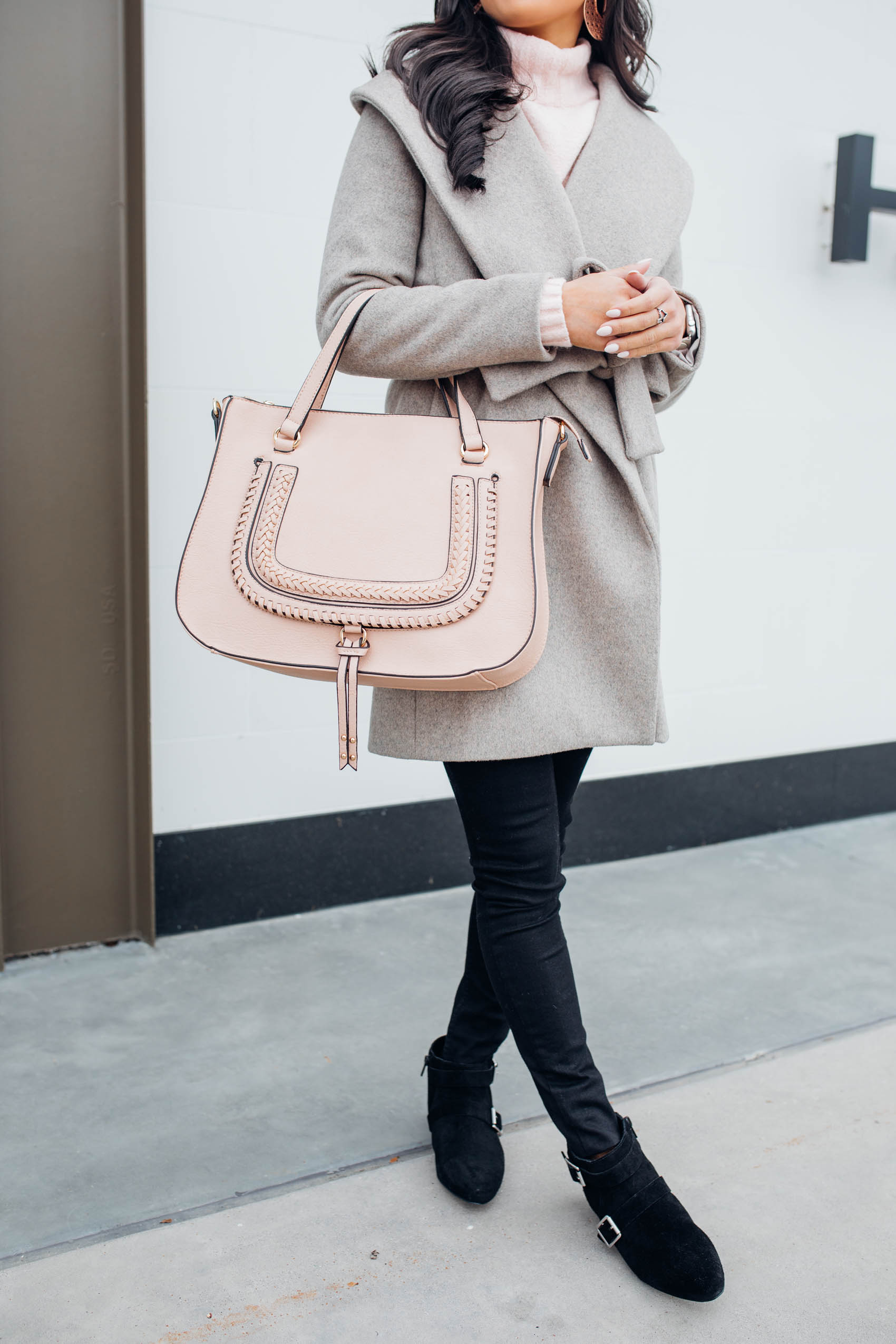 Blogger Hoang-Kim wears a vegan leather handbag and suede booties by Sole Society