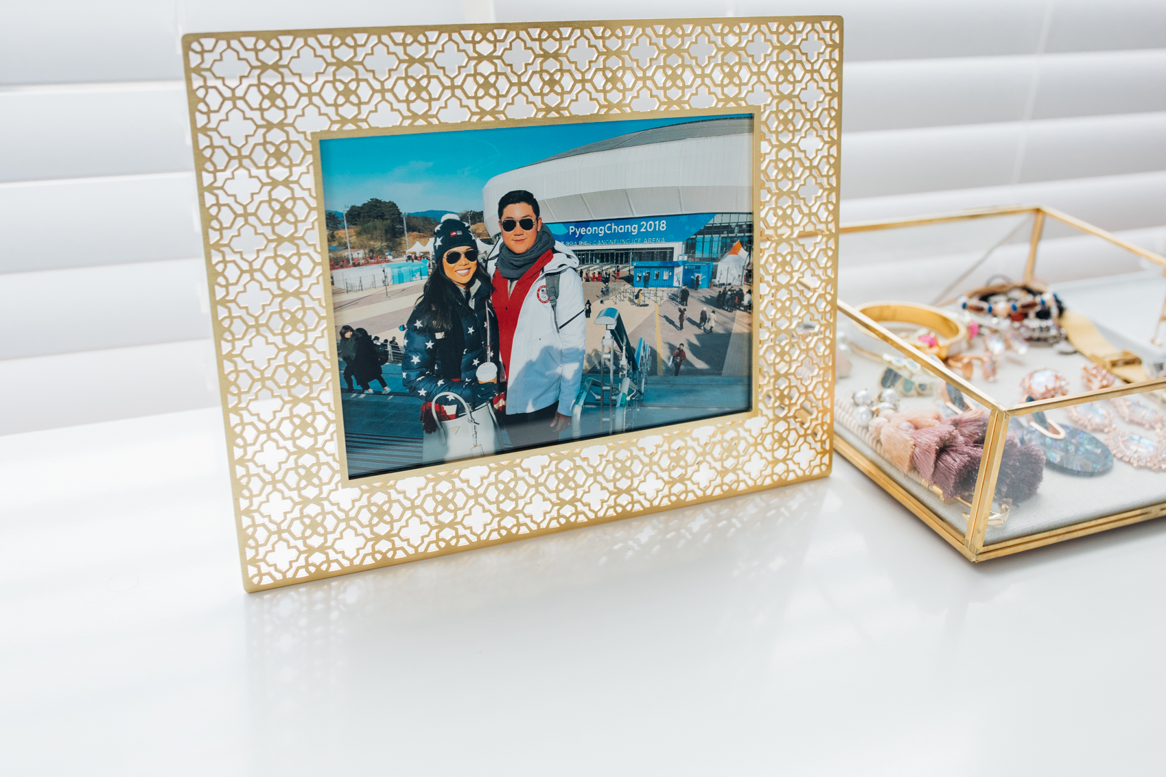 Blogger Hoang-Kim shares her dresser decor featuring a Kendra Scott frame