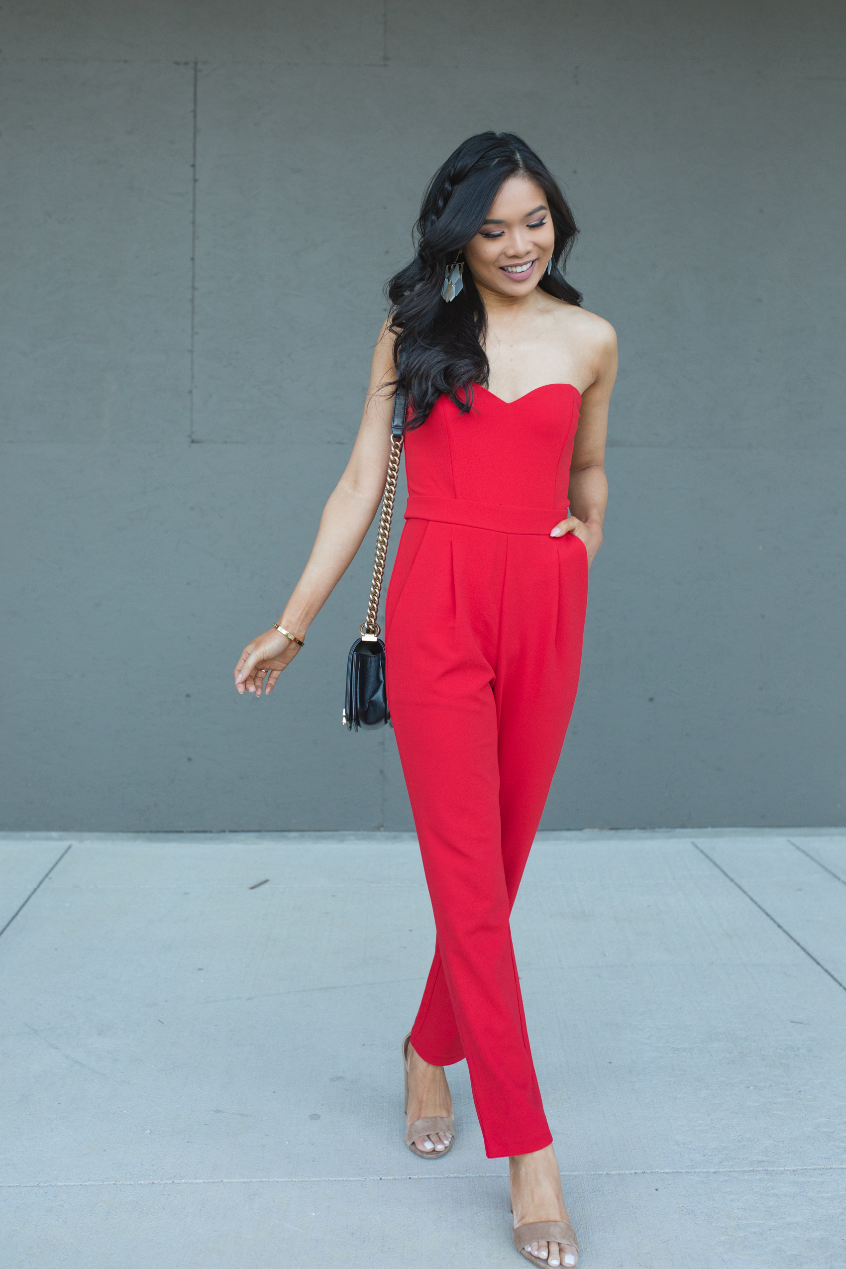 Red jumpsuit as a wedding guest dress alternative on petite blogger Hoang-Kim