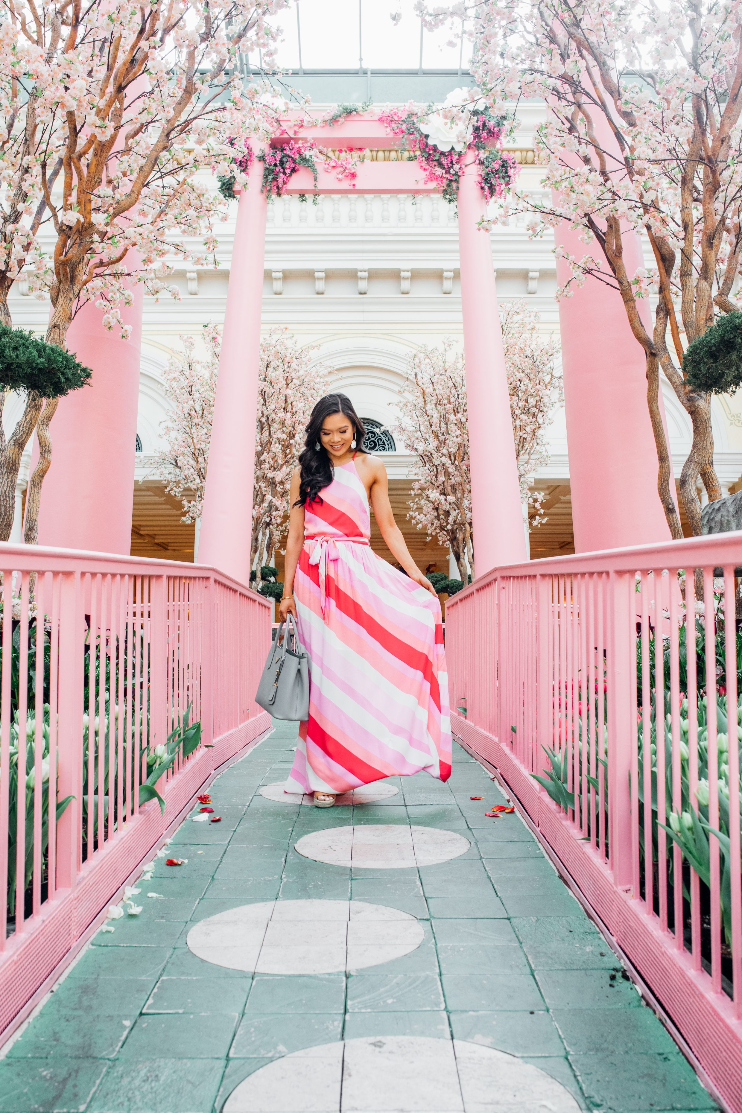 Hoang-Kim wears the striped sunset soiree maxi dress from Vici at the Bellagio Gardens Japanese Spring