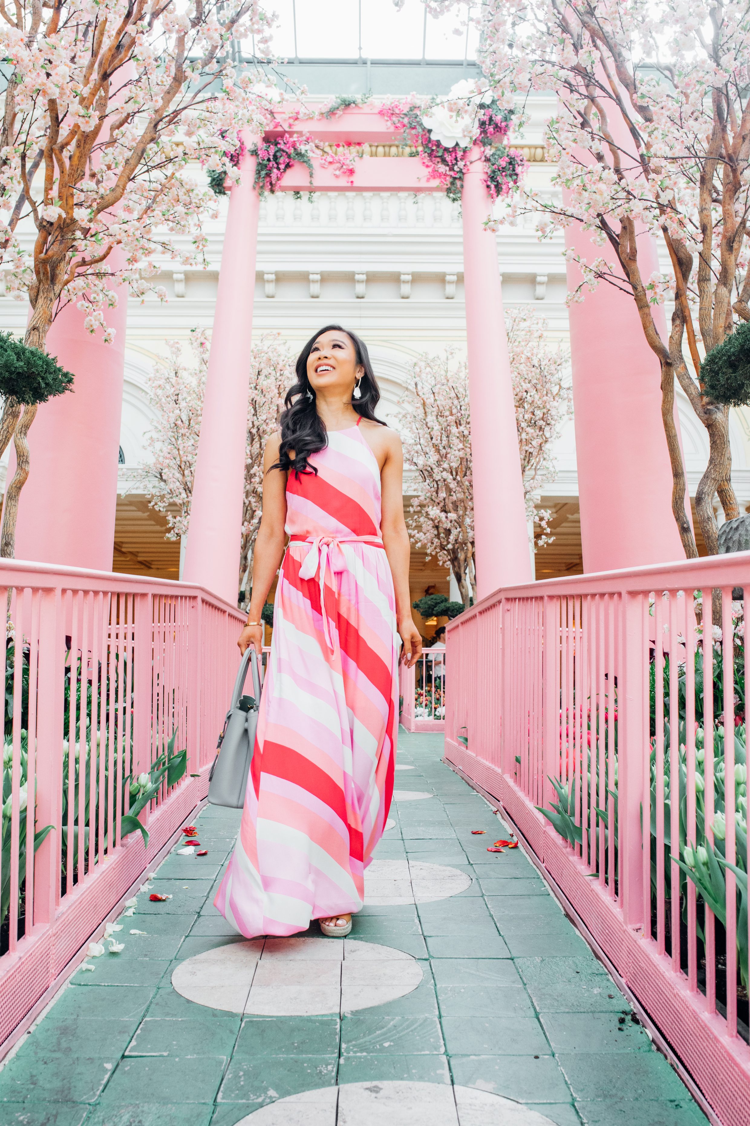 Hoang-Kim wears the striped sunset soiree maxi dress from Vici at the Bellagio Gardens Japanese Spring