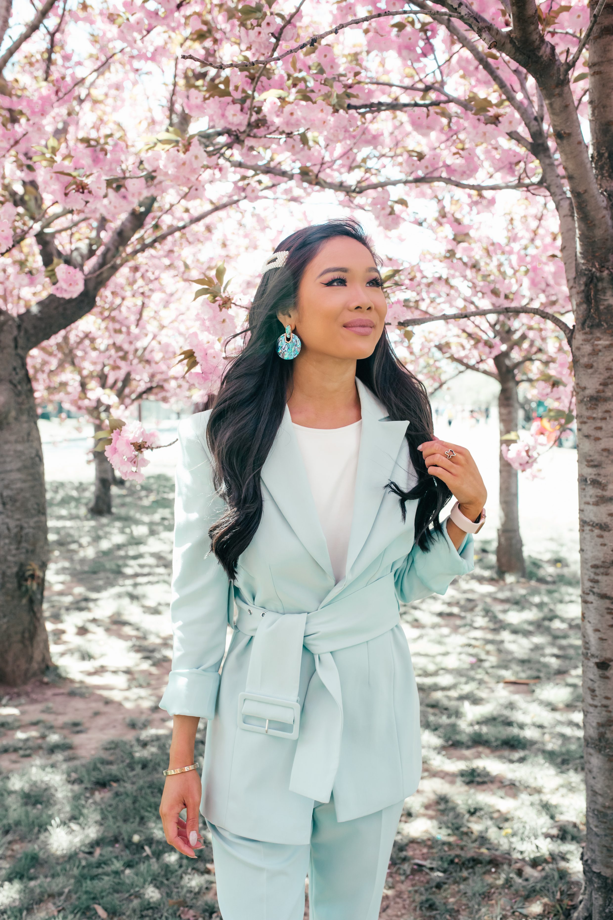 Blogger Hoang-Kim wears a mint green suit to see Cherry Blossoms in Washington, D.C