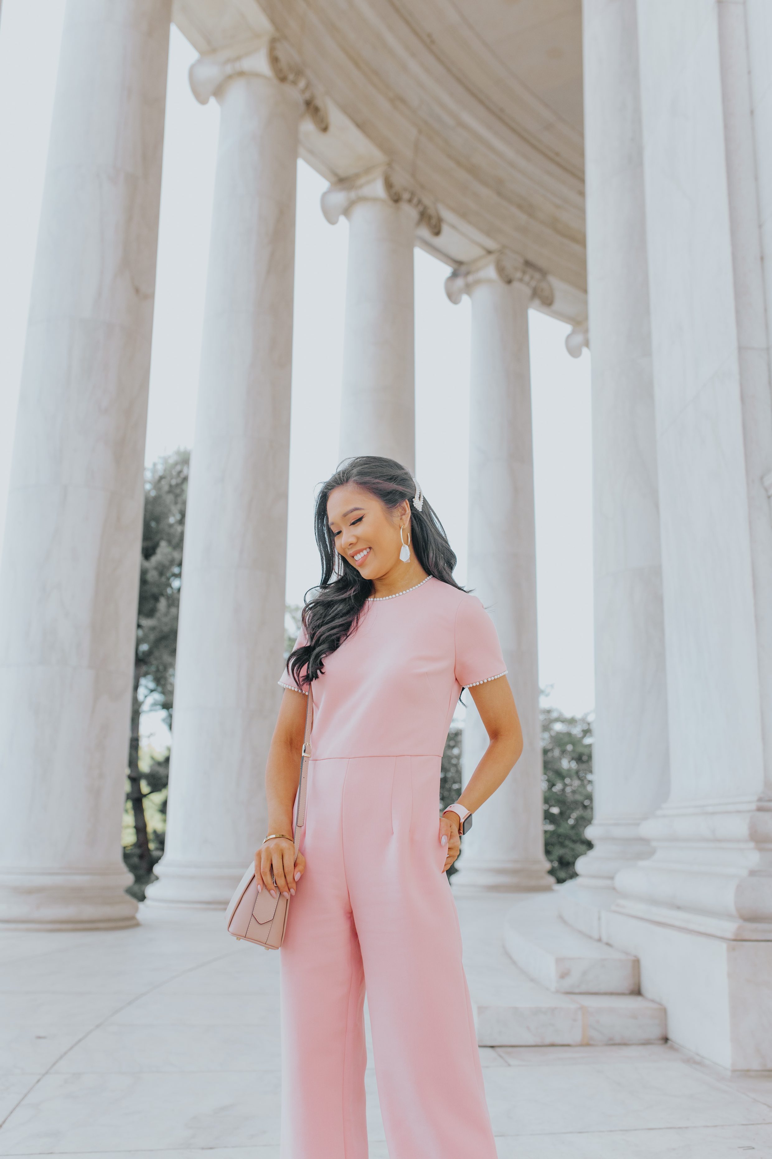 Petite blogger wears a pink pearl trim jumpsuit at the Jefferson Memorial