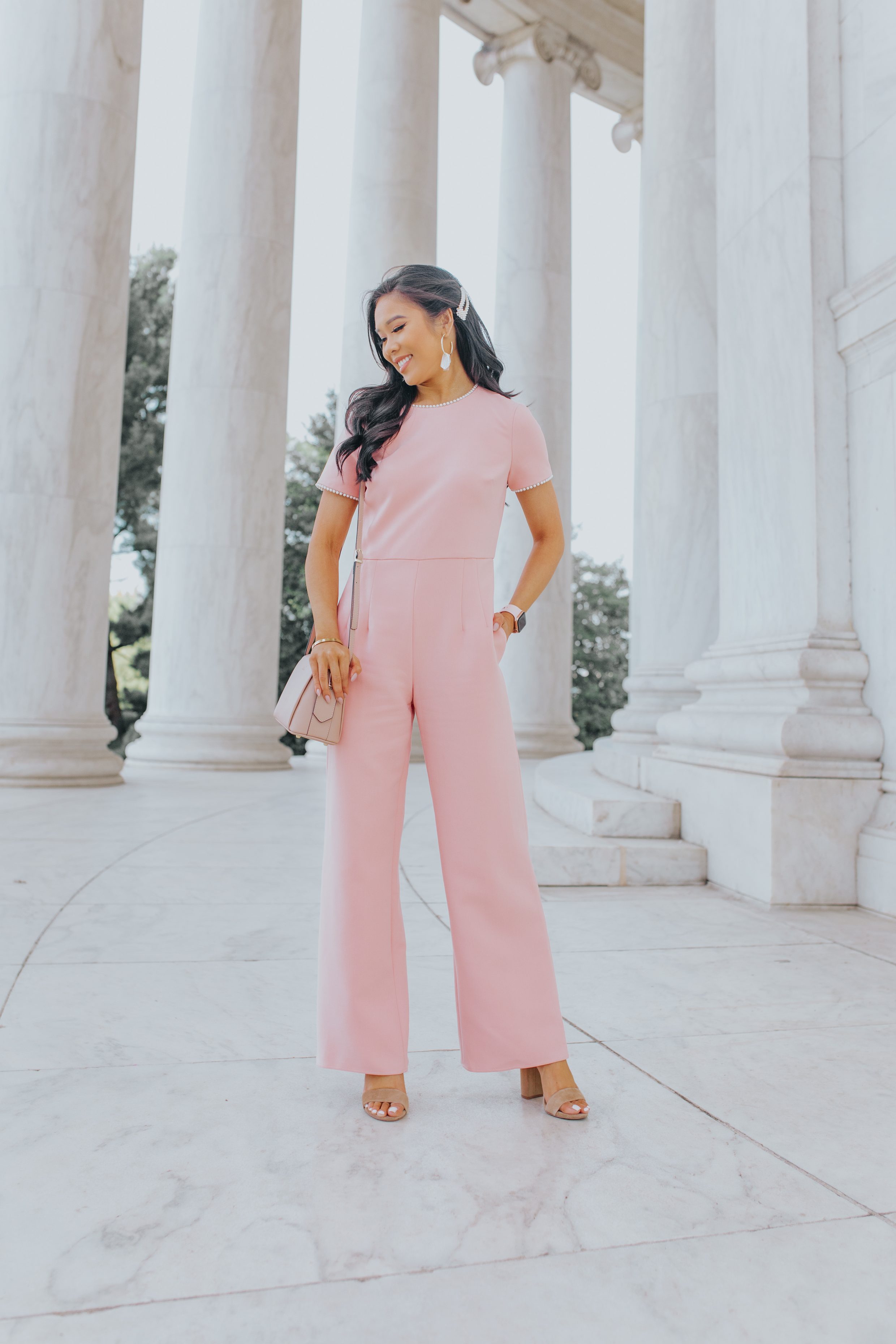 Blogger Hoang-Kim wears a pink pearl trim dressy jumpsuit from Gal Meets Glam