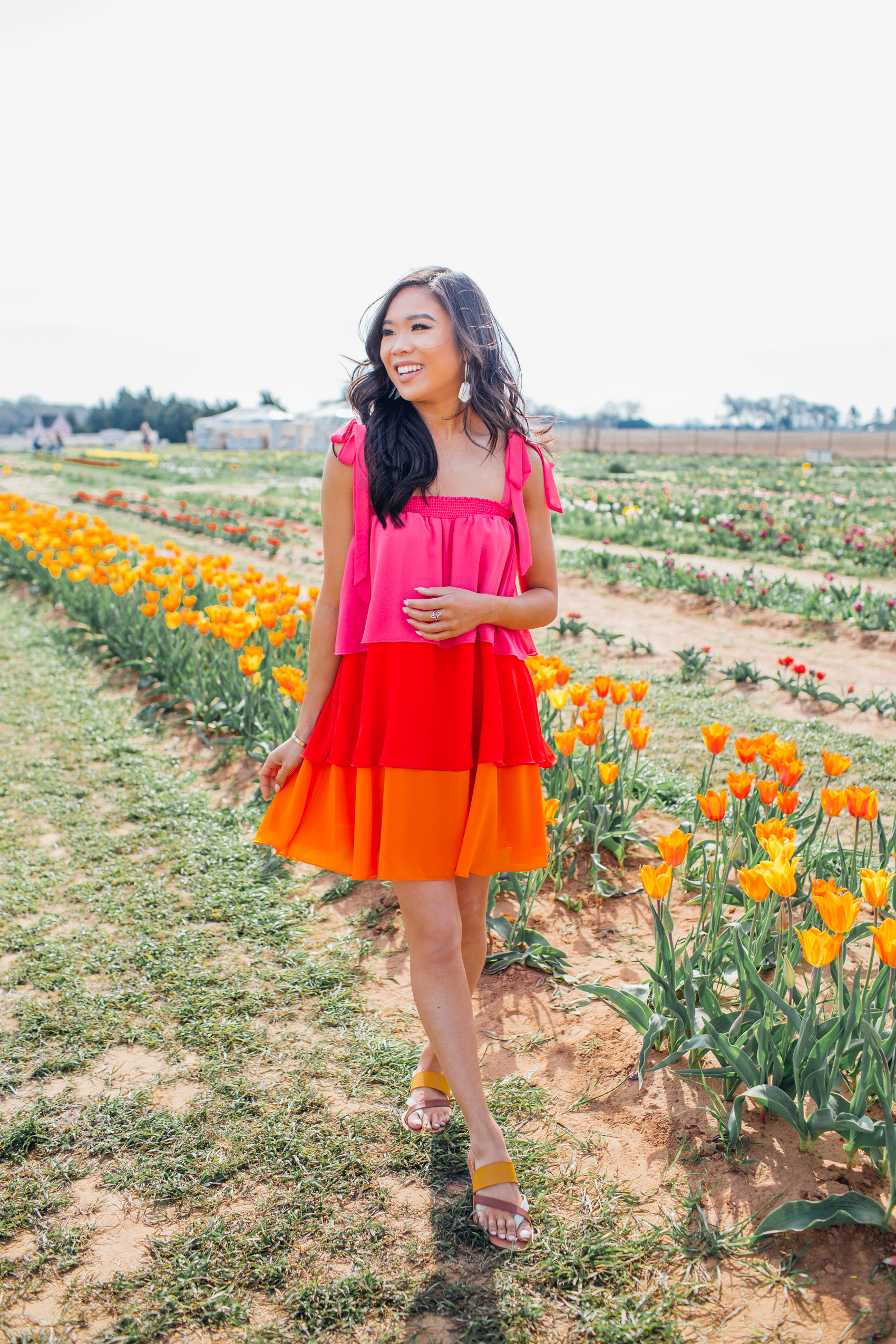 Blogger Hoang-Kim wears a Show Me Your Mumu convertible skirt dress to a tulip farm in Texas