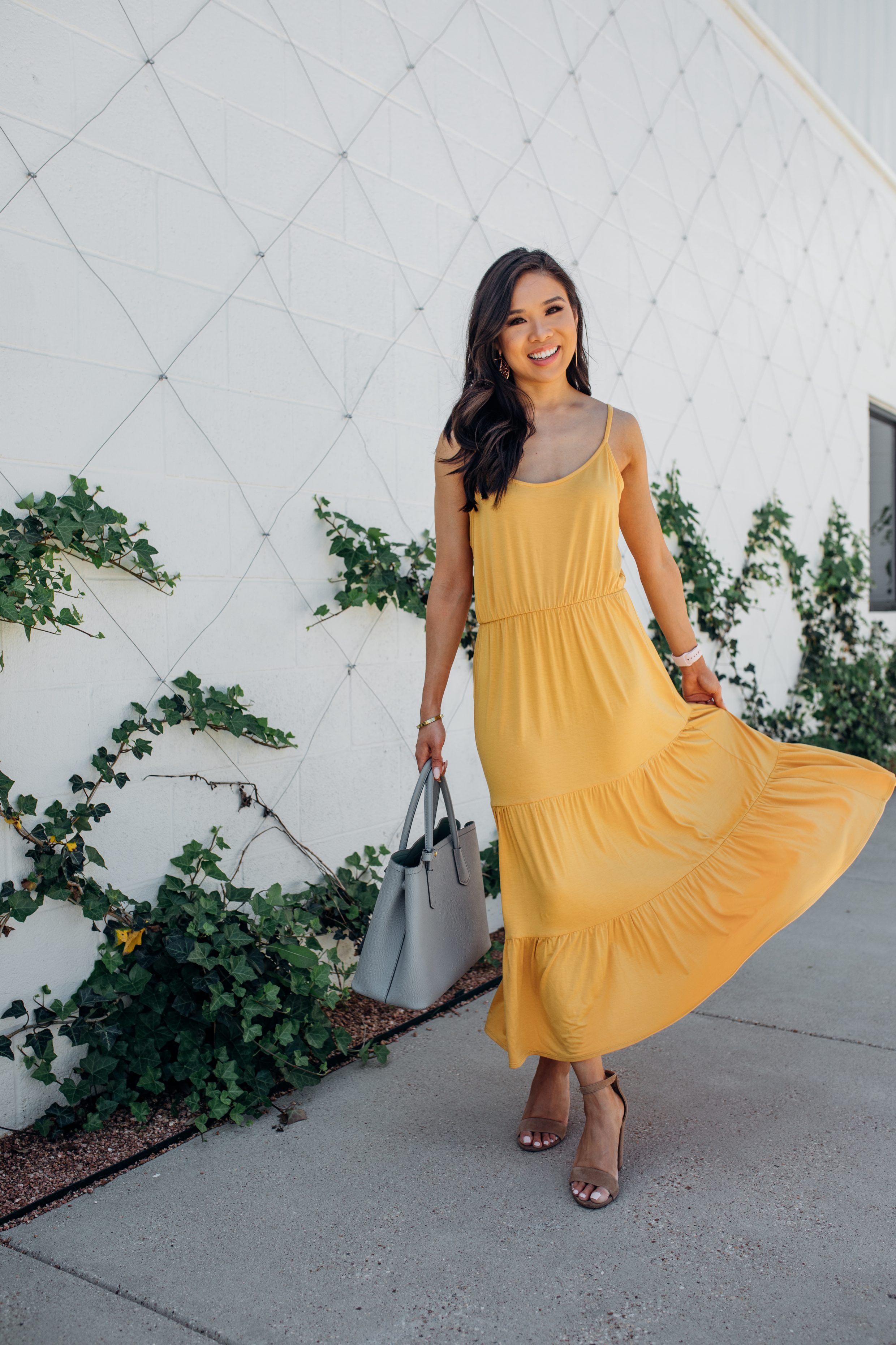 Blogger Hoang-Kim wears a yellow tiered maxi dress 
