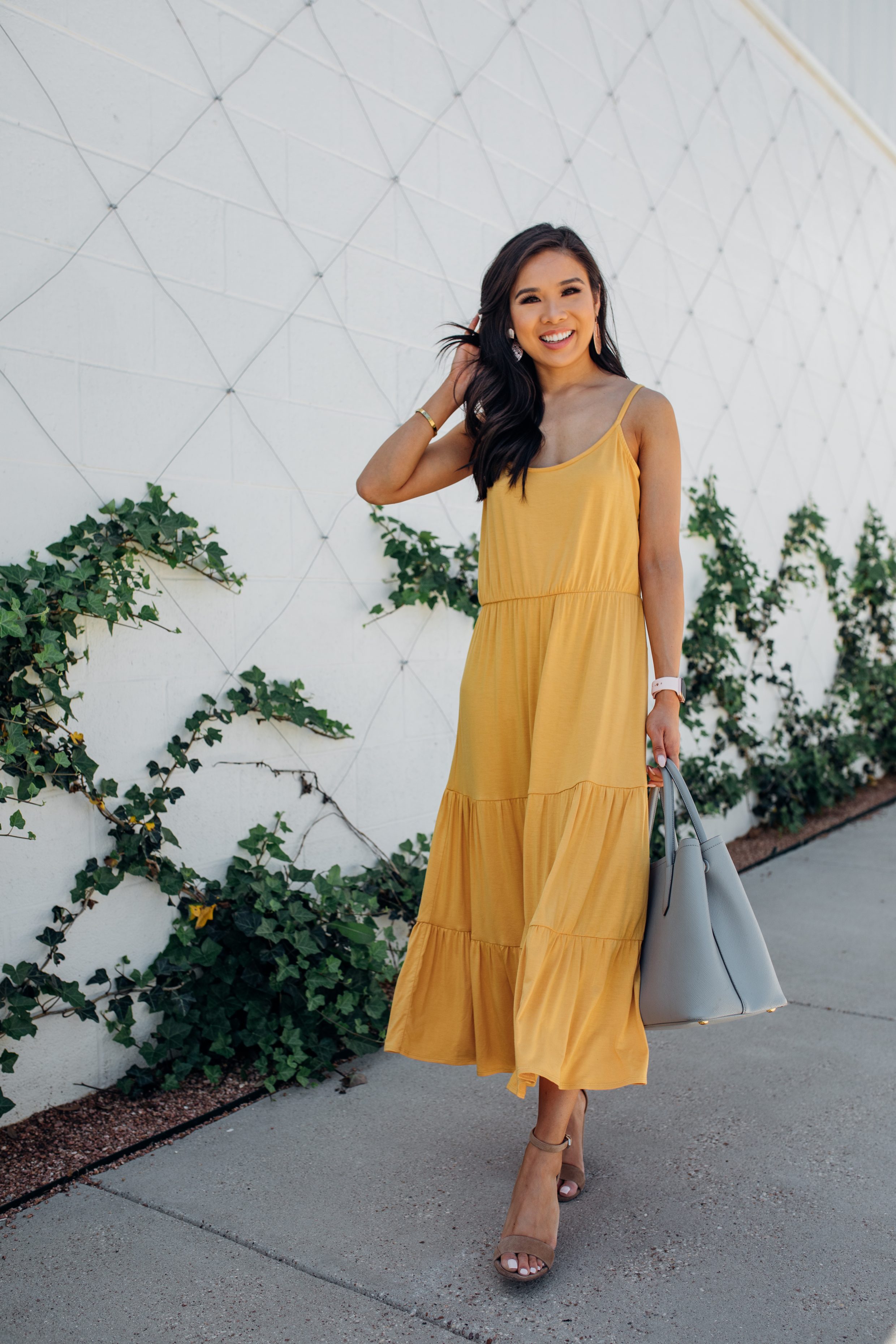 Blogger Hoang-Kim wears a marigold tiered maxi dress 