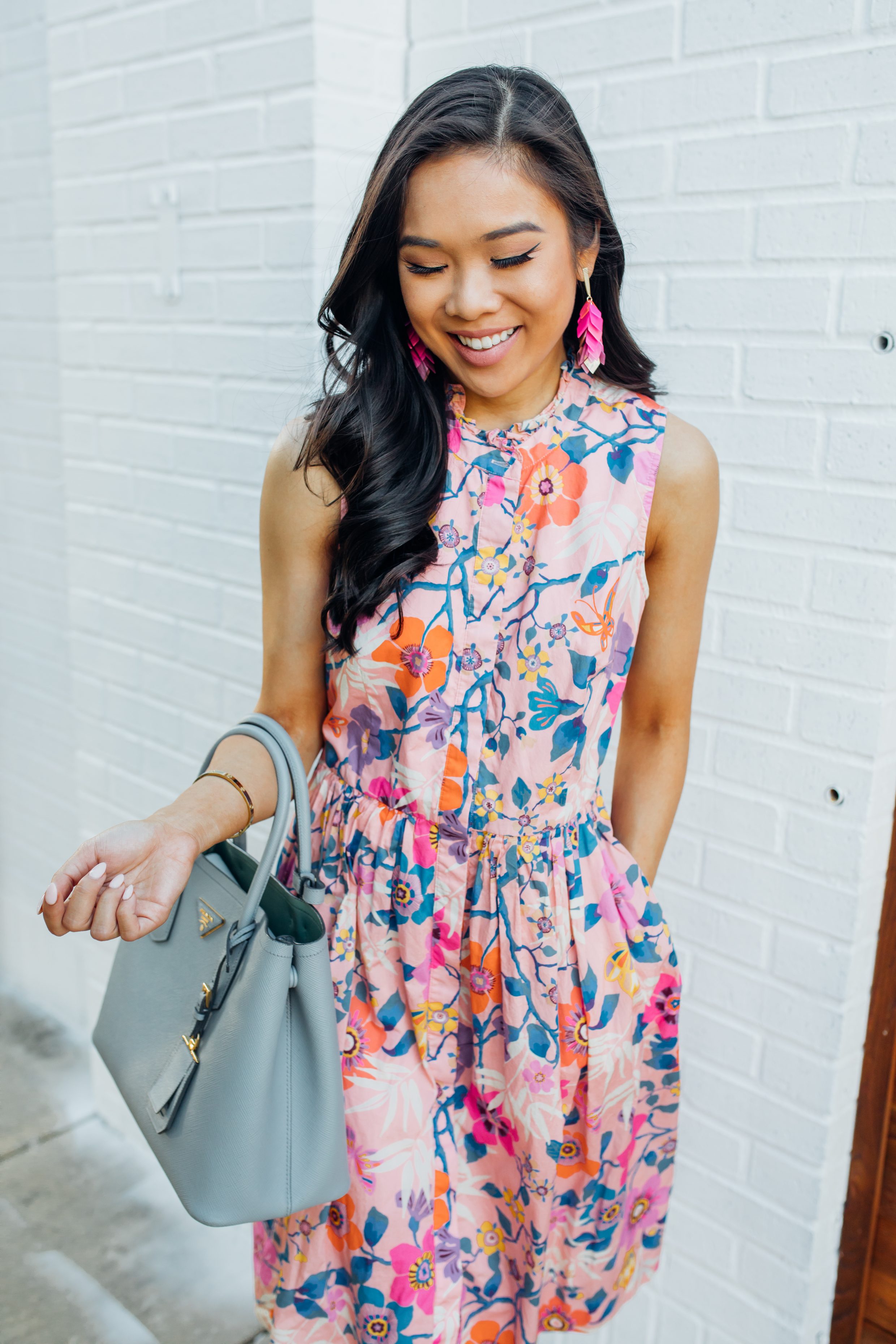 Blogger Hoang-Kim wears the Kendra Scott Jennifer earrings with a J.Crew x Liberty Dress