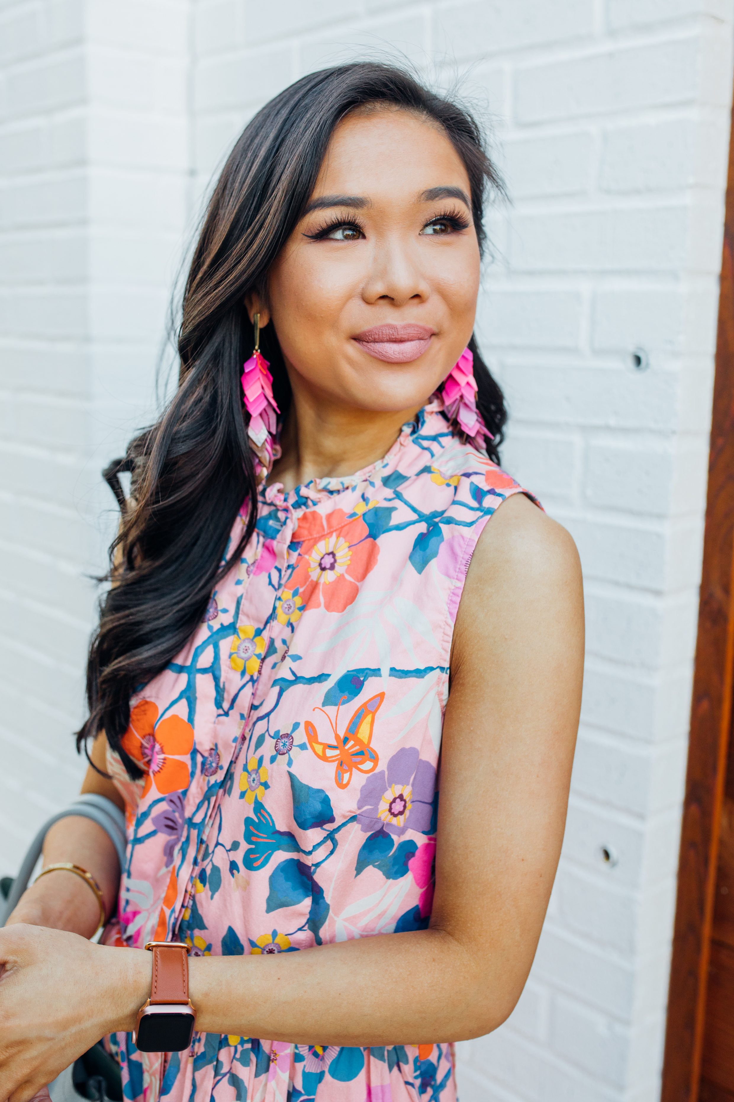 Blogger Hoang-Kim wears a floral shirtdress with pink acrylic tassel earrings
