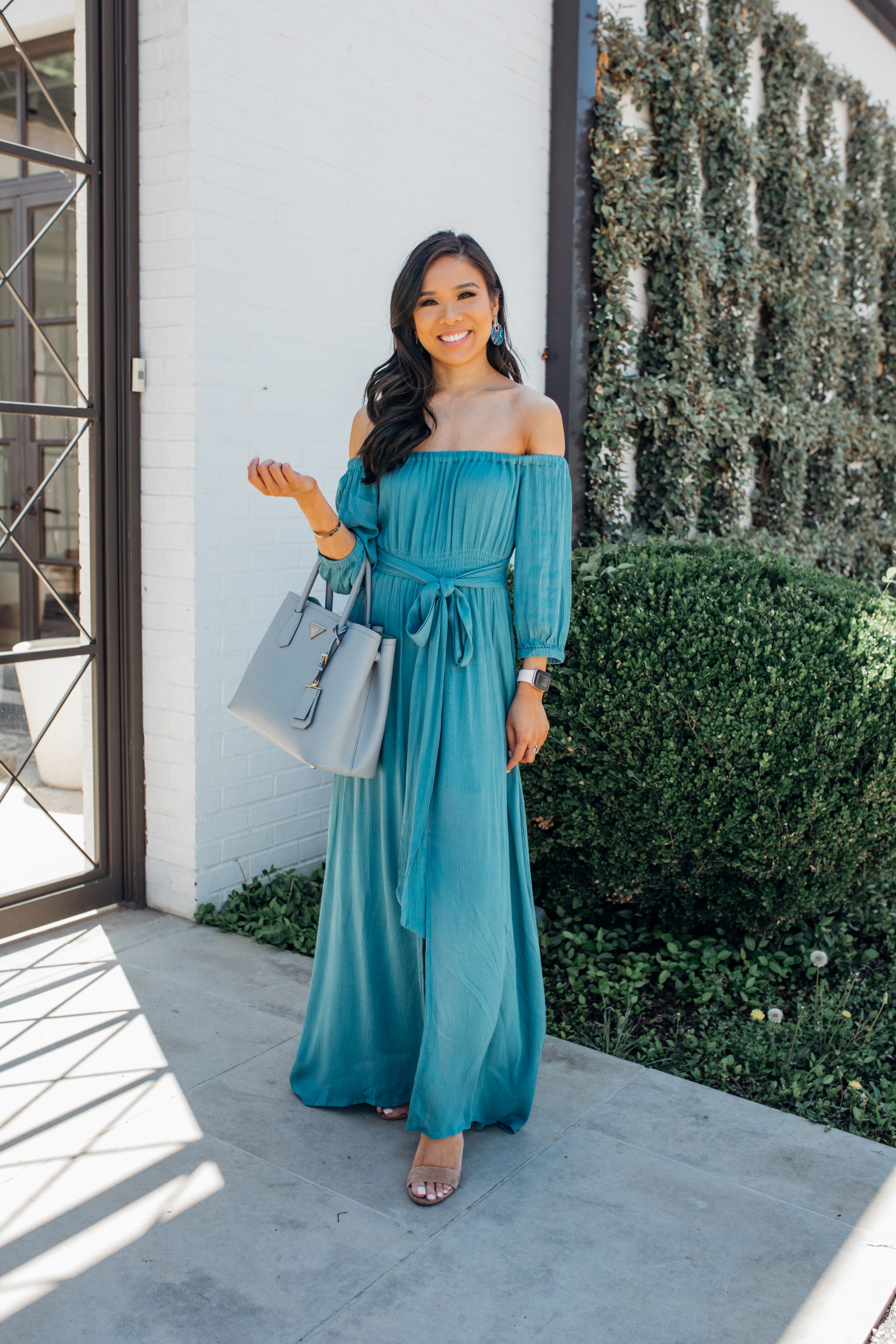 Blogger Hoang-Kim wears a teal off-the-shoulder maxi