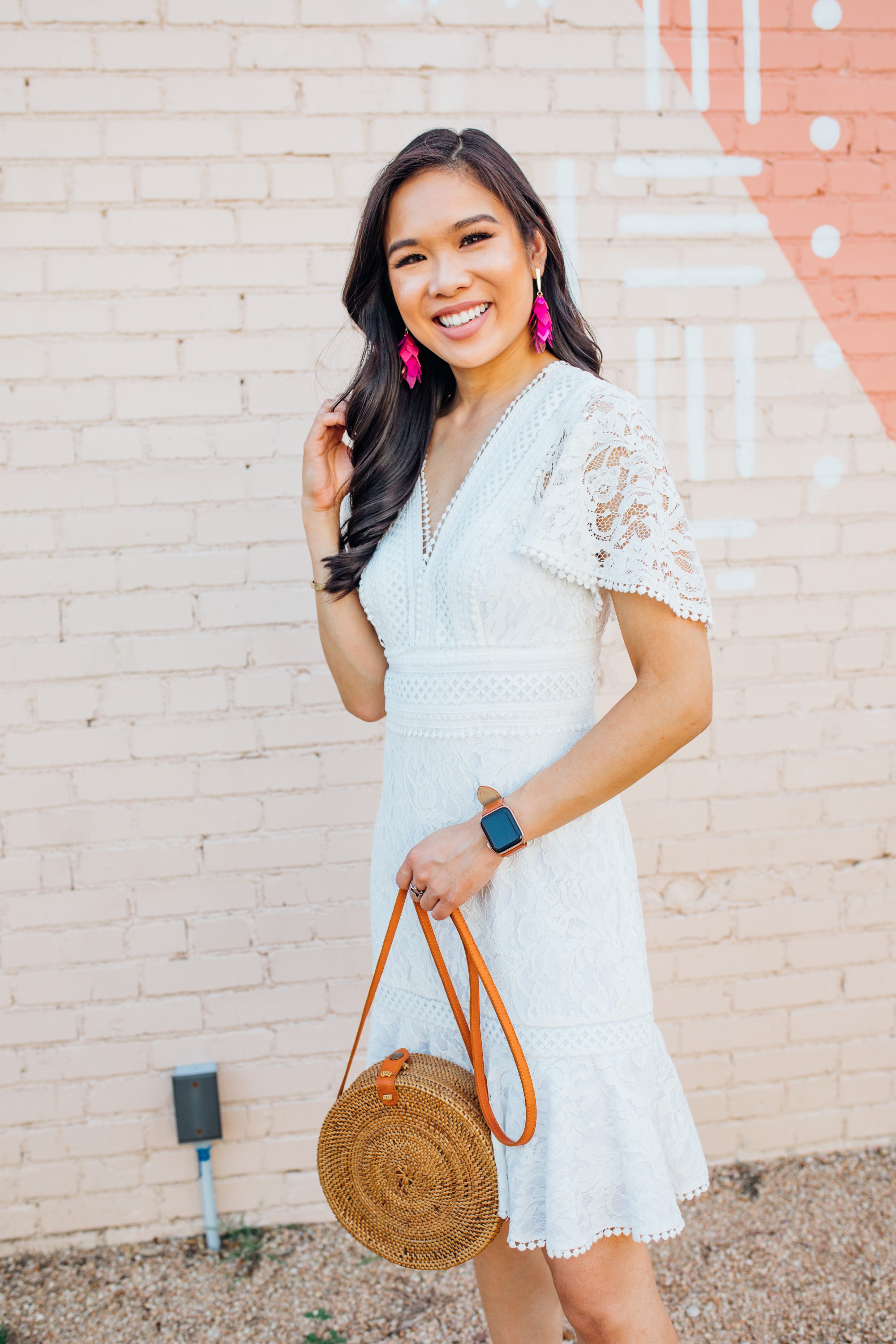 Blogger Hoang-Kim shares a white lace dress for a summer outfit of the day