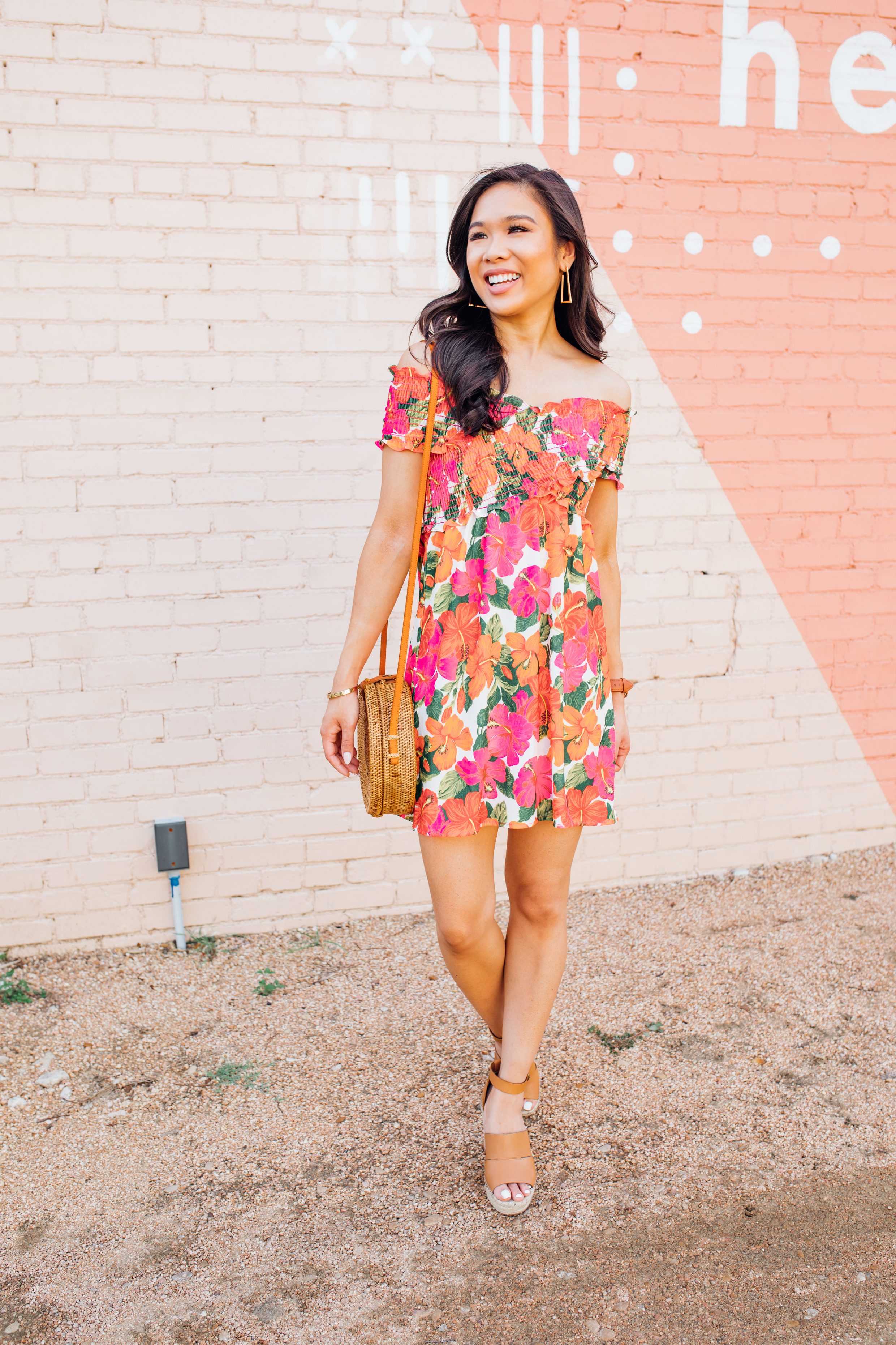 Blogger Hoang-Kim wears Kendra Scott Easton earrings with a tropical floral dress