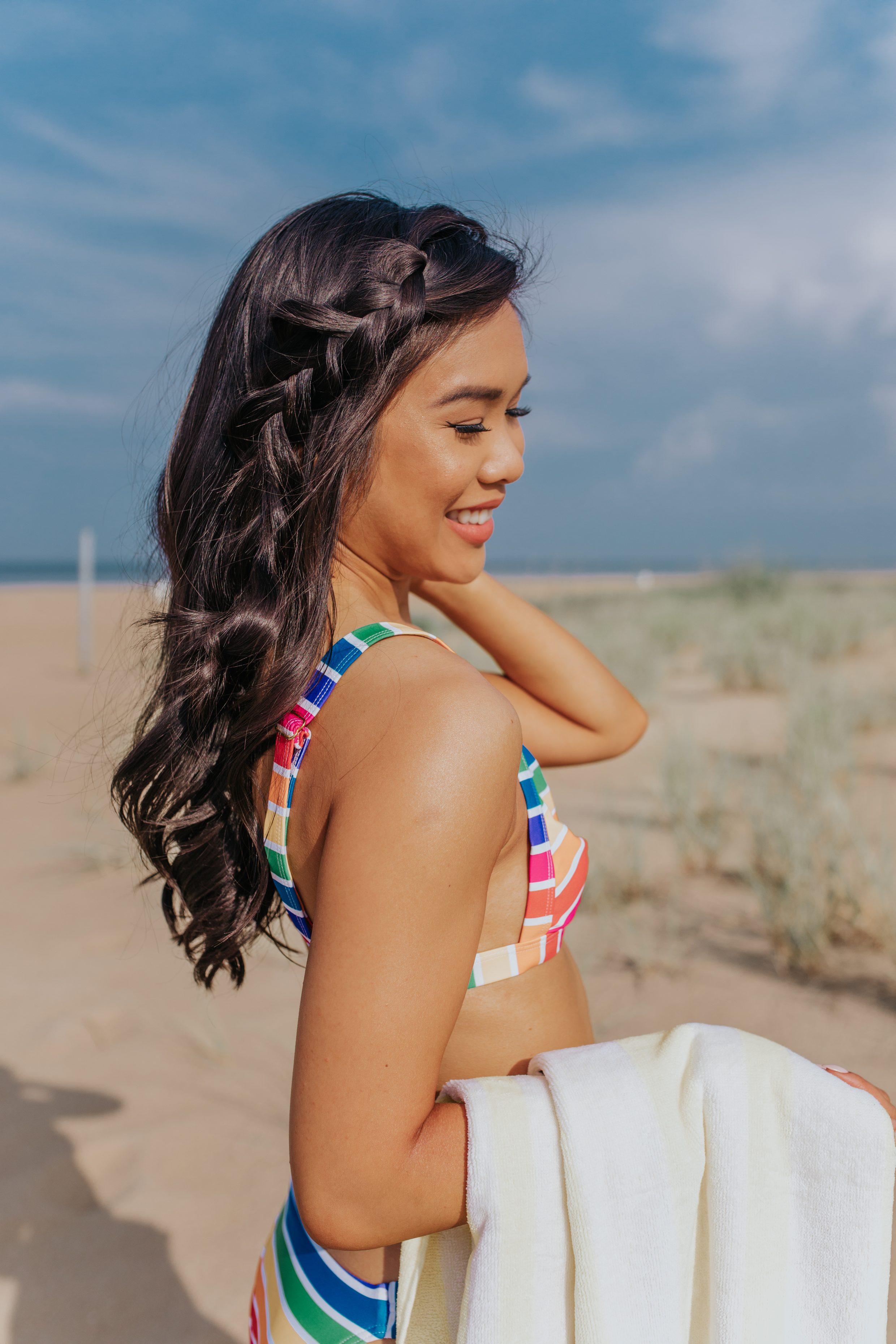 Blogger Hoang-Kim with a loose, messy braid for a beach hairstyle