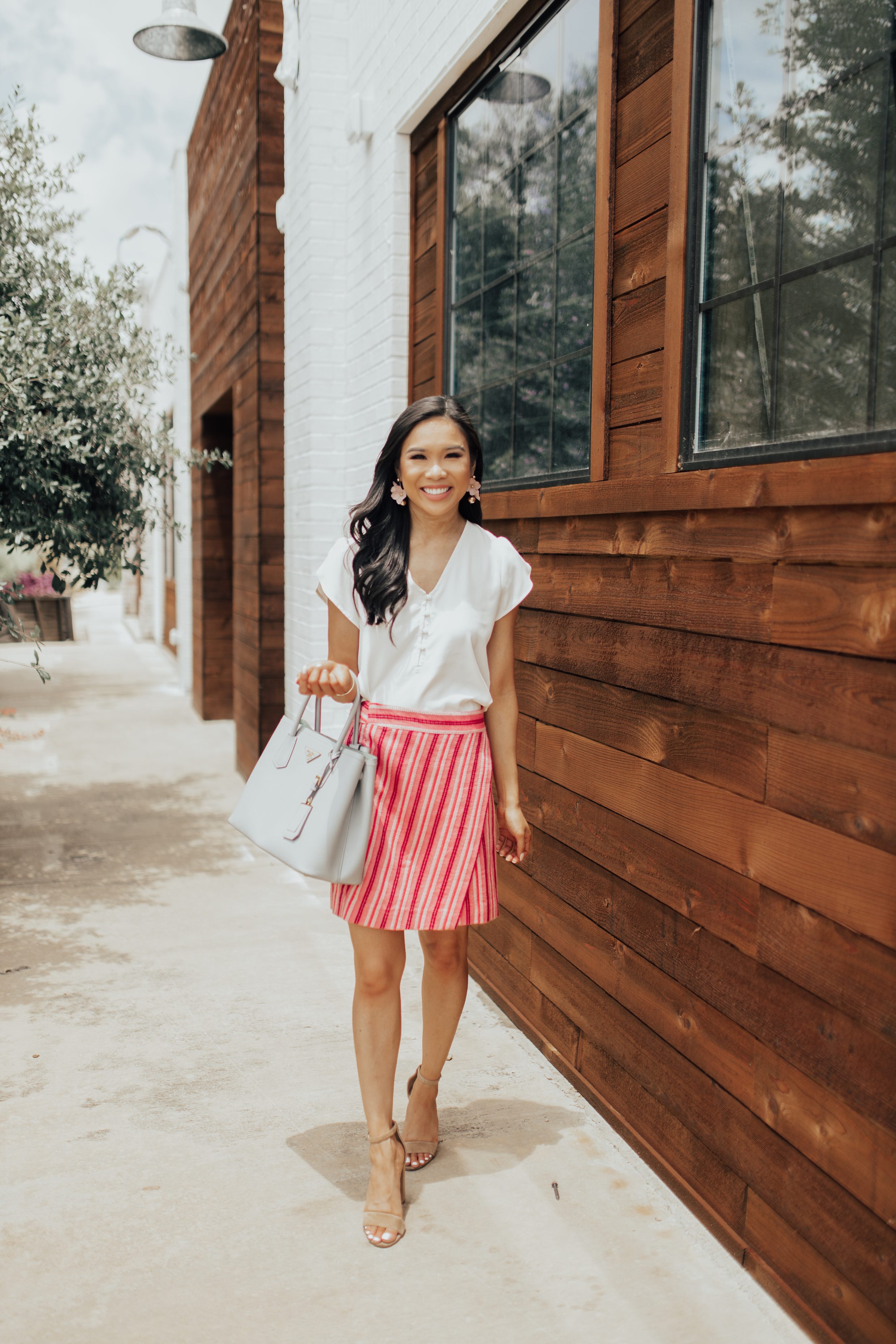 Petite blogger wears olive + piper sarahi earrings with a loft wrap skirt