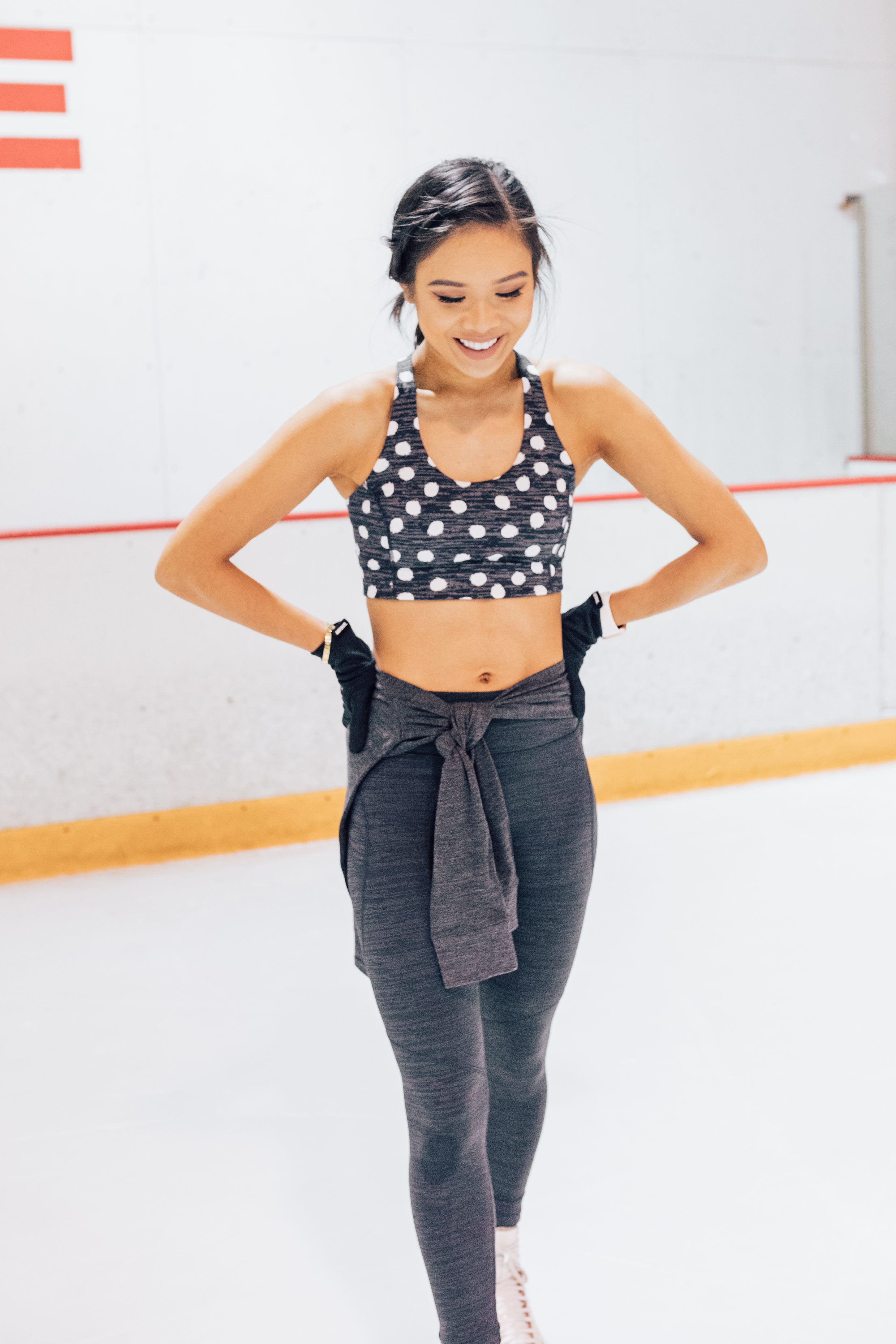 Blogger Hoang-Kim wears a polka dot Outdoor Voices workout set