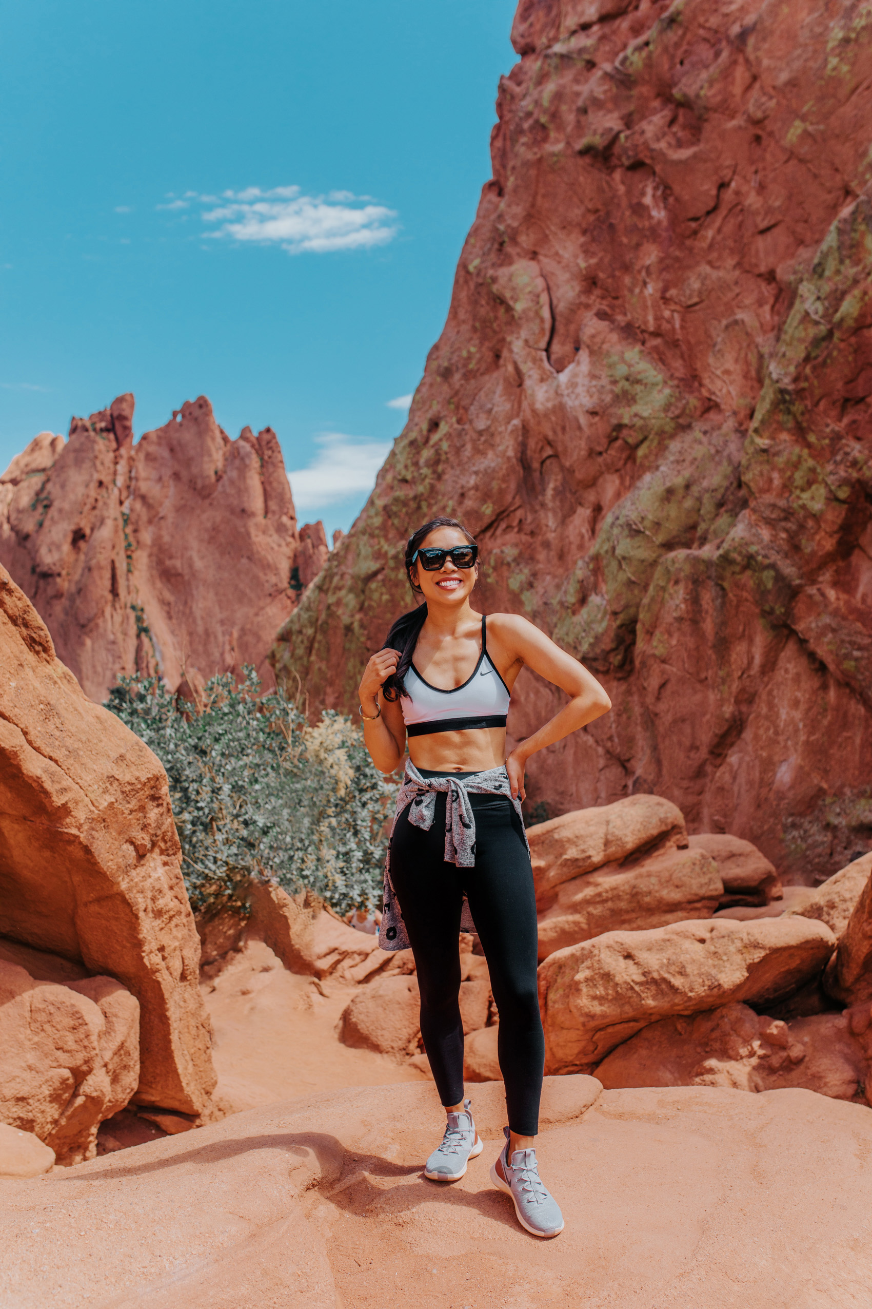 Brunette woman wearing Nike workout clothes at Garden of the Gods in Colorado Springs - Colorado Travel Guide