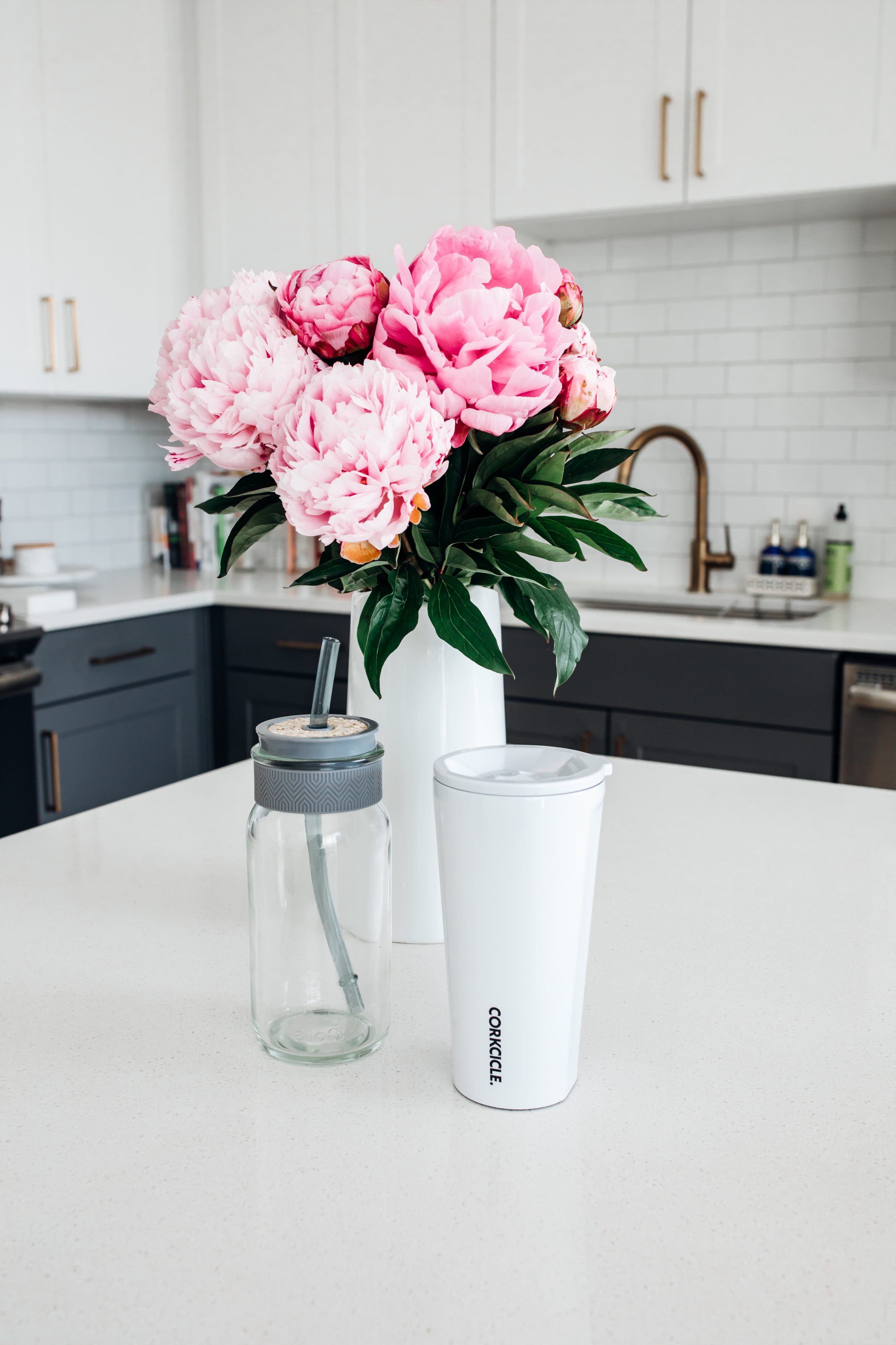 The best kitchen items include a glass tumbler and Corkicle insulated tumbler
