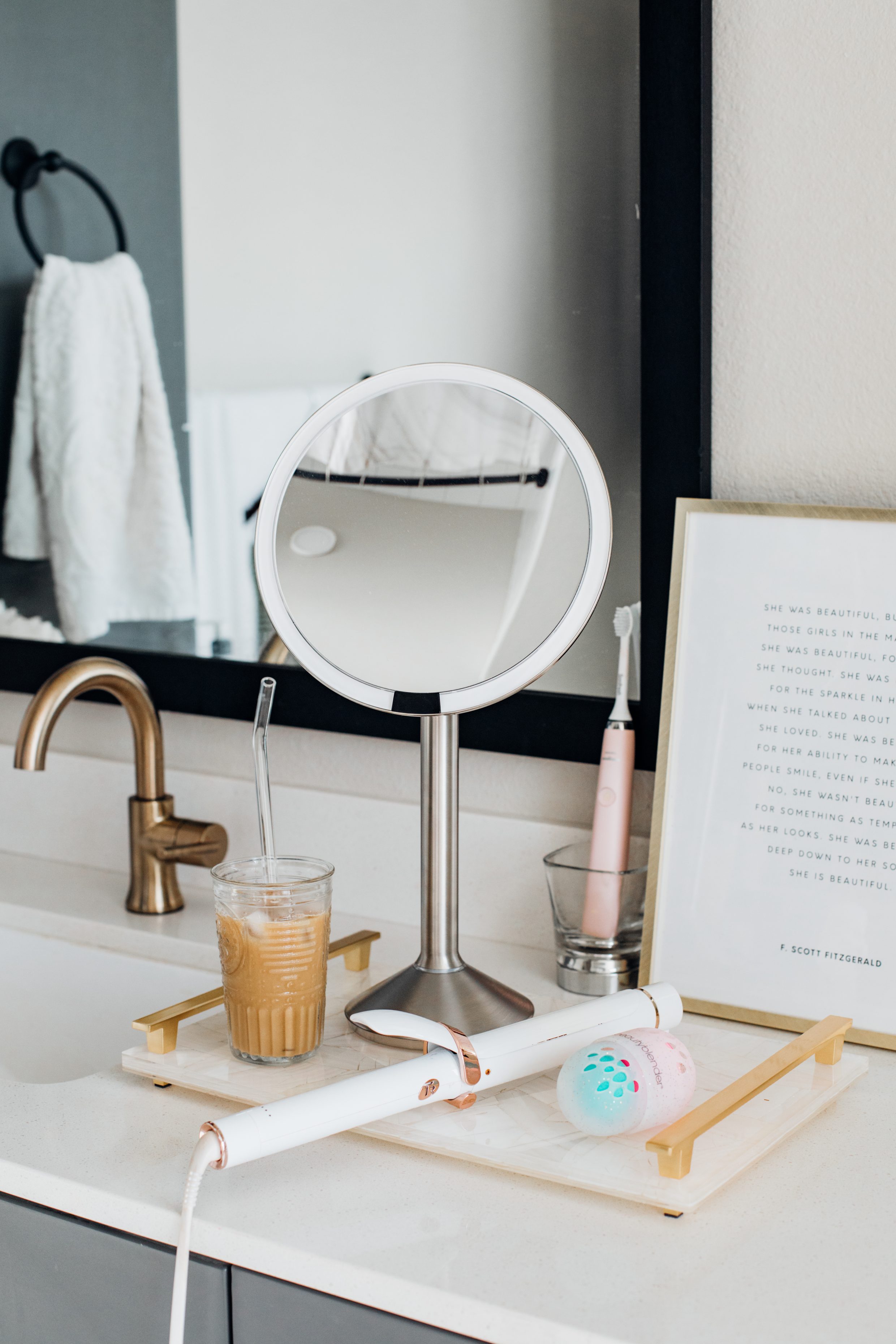 Top beauty picks for the Nordstrom Anniversary Sale 2019 - simplehuman sensor mirror, T3 curling iron in a bathroom in a Dallas apartment