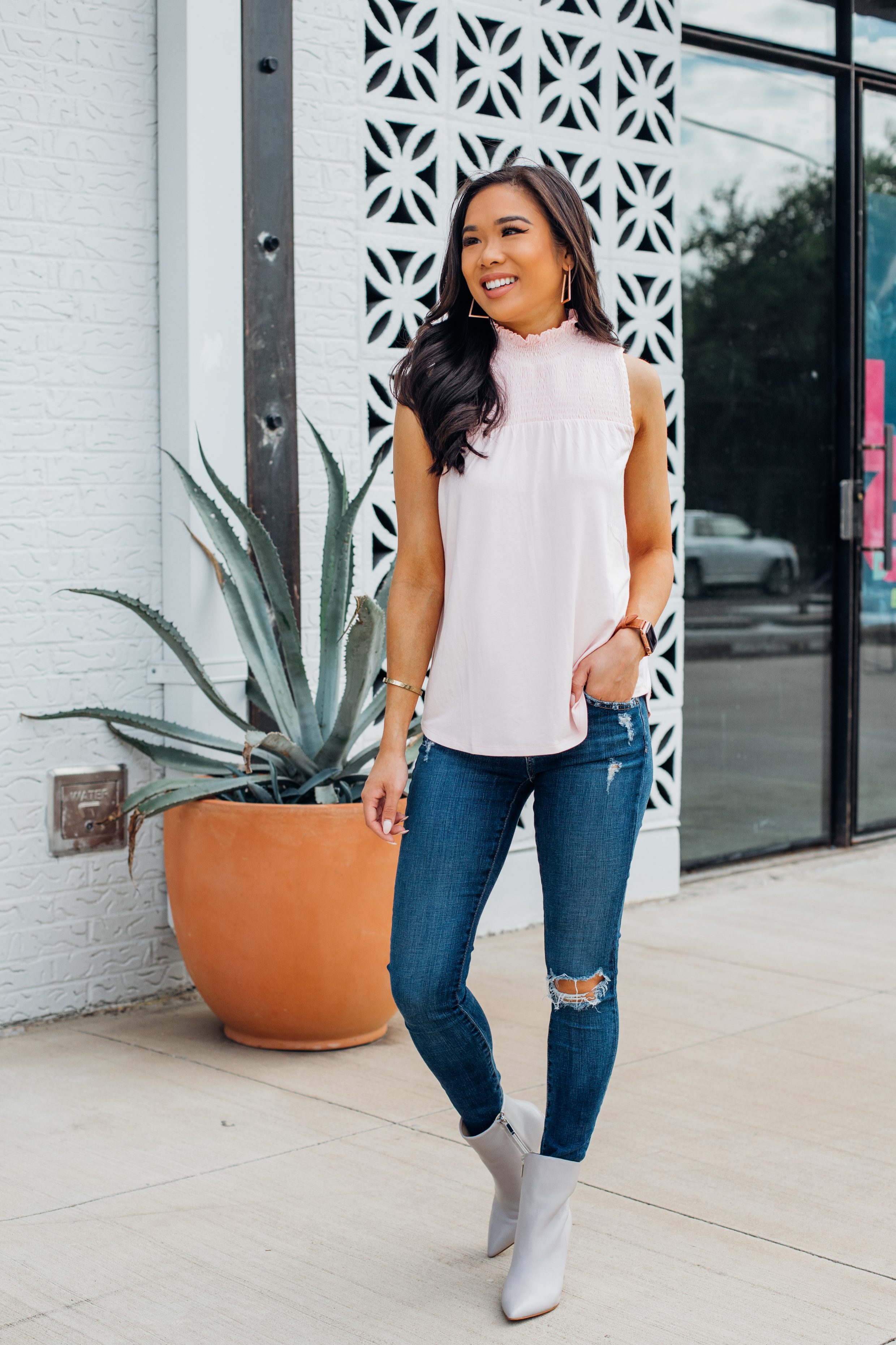 Blogger Hoang-Kim wears a Gibson smock neck jersey top with AG jeans and Marc Fisher Unique Bootie