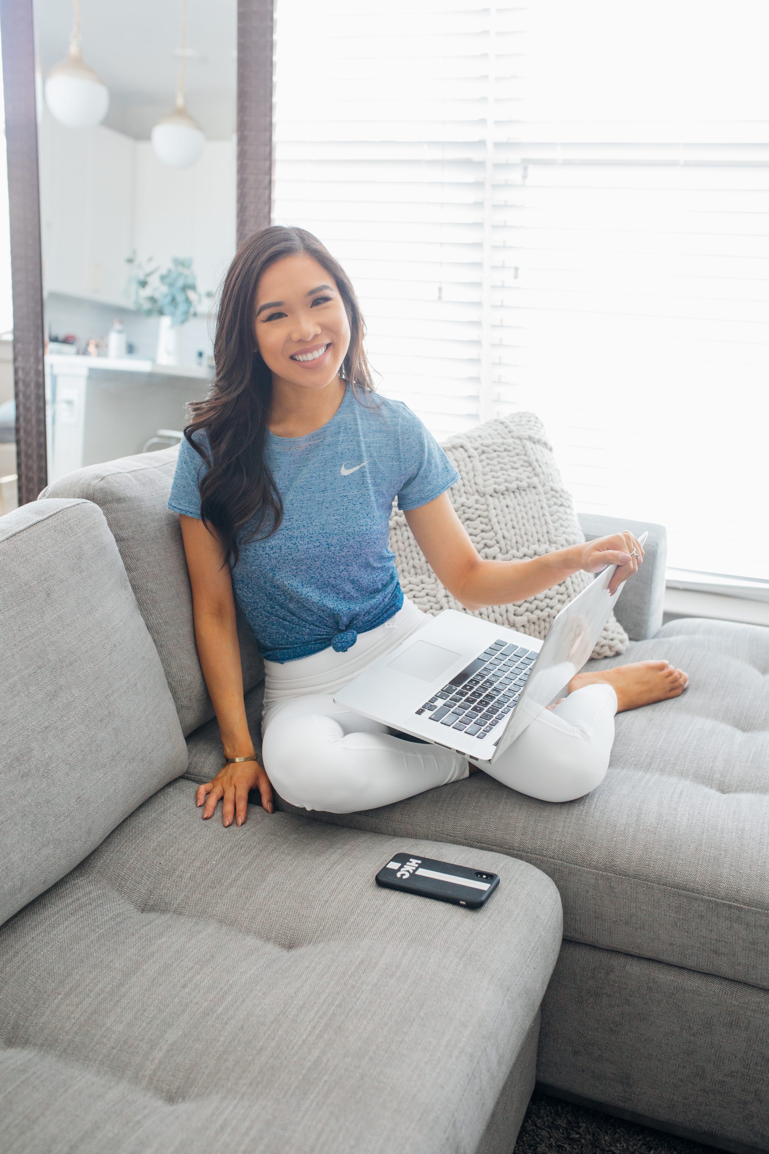 Blogger Hoang-Kim wears a blue and white activewear outfit