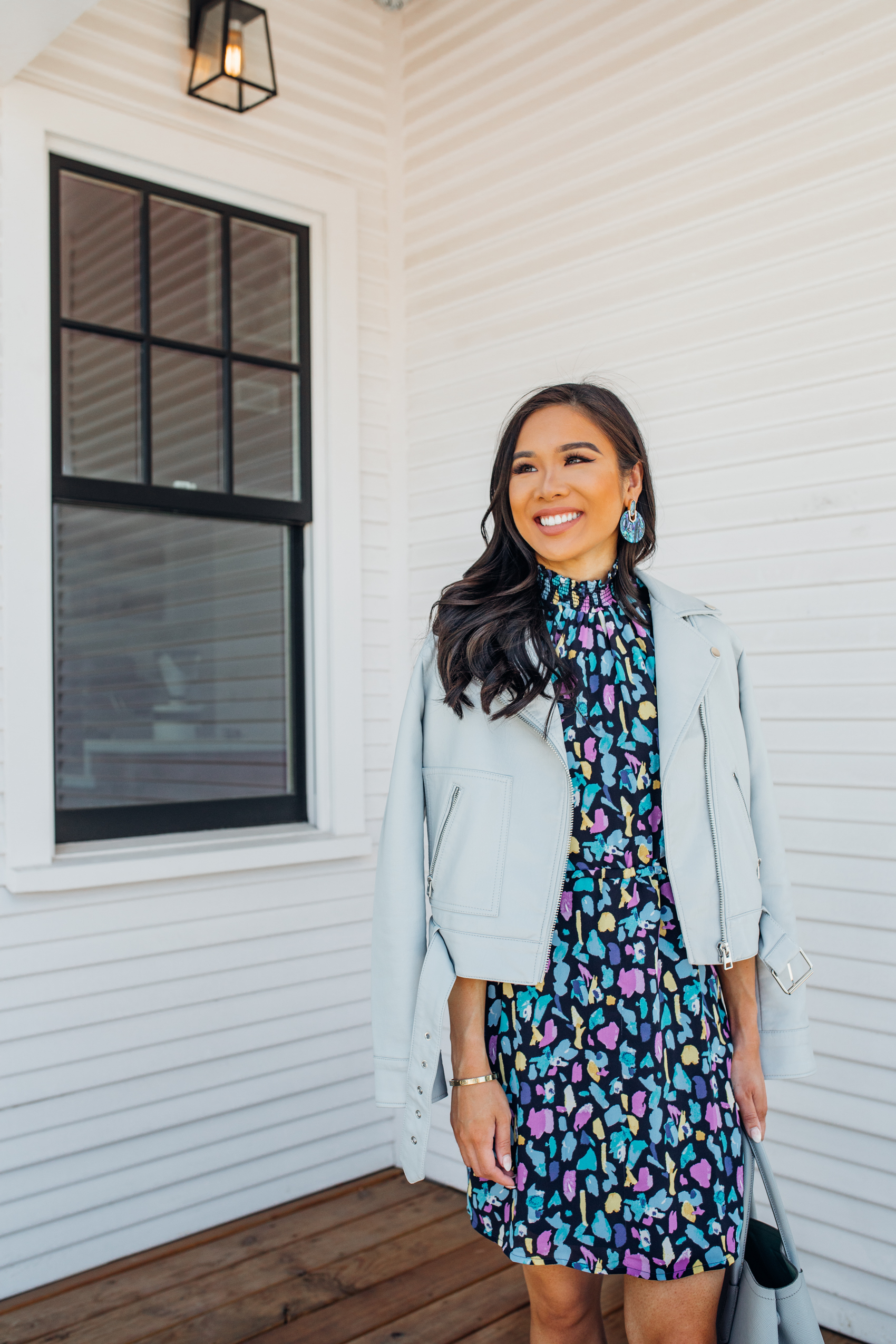 Blogger Hoang-Kim shares how to transition an outfit from summer to fall with a Gibson dress, Topshop leather jacket and Kendra Scott Didi earrings