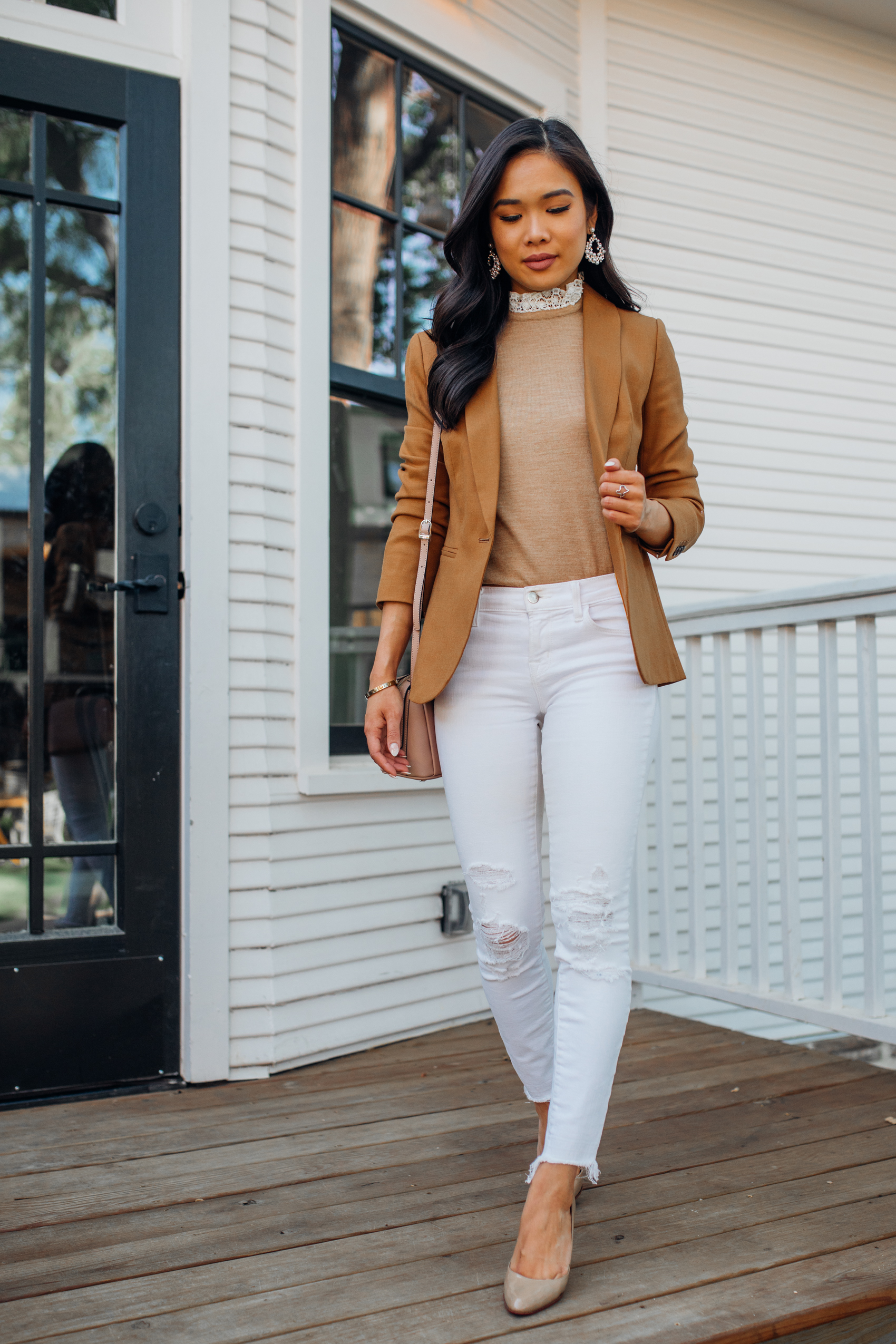 Blogger Hoang-Kim wears a brown blazer outfit with lace collar sweater, distressed white jeans and shares what to look for when buying a blazer