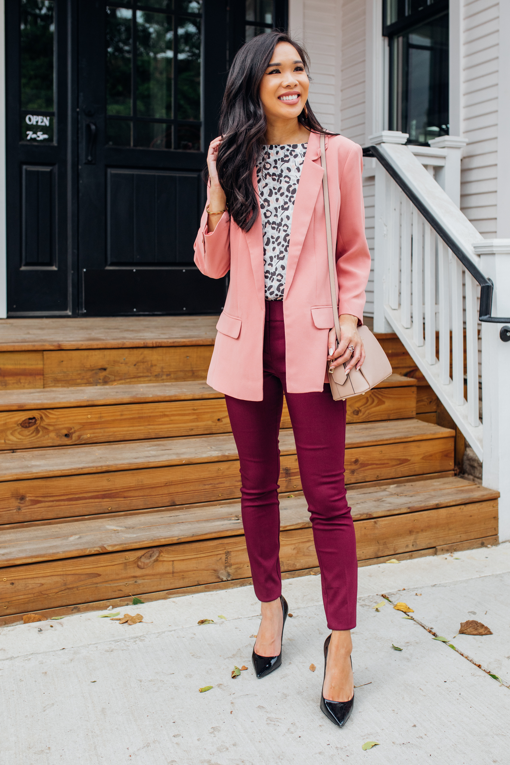 Petite work outfit with a leopard print blouse, burgundy pants and pink blazer