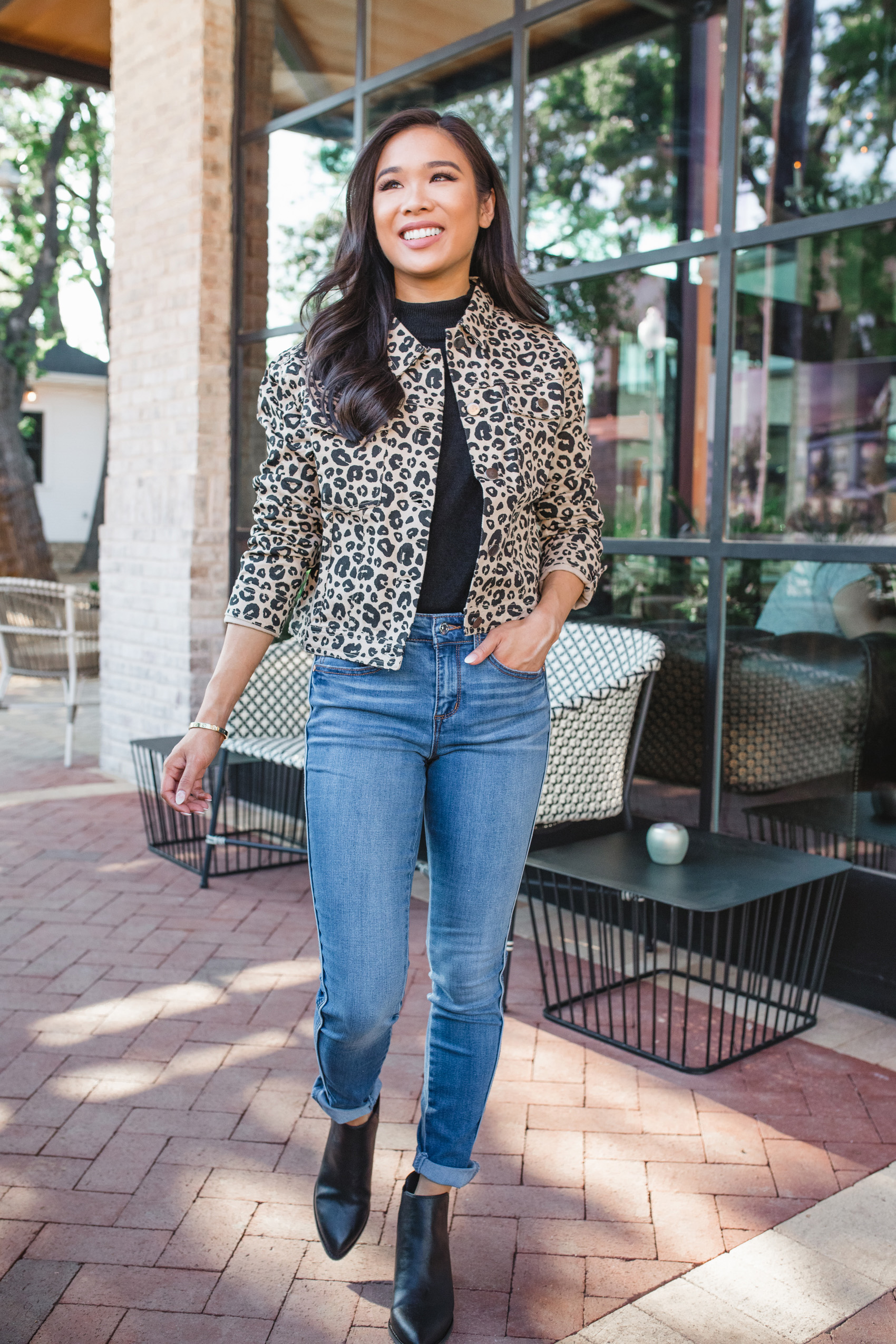 Leopard jacket, black sweater, blue jeans and black booties all affordable fall fashion