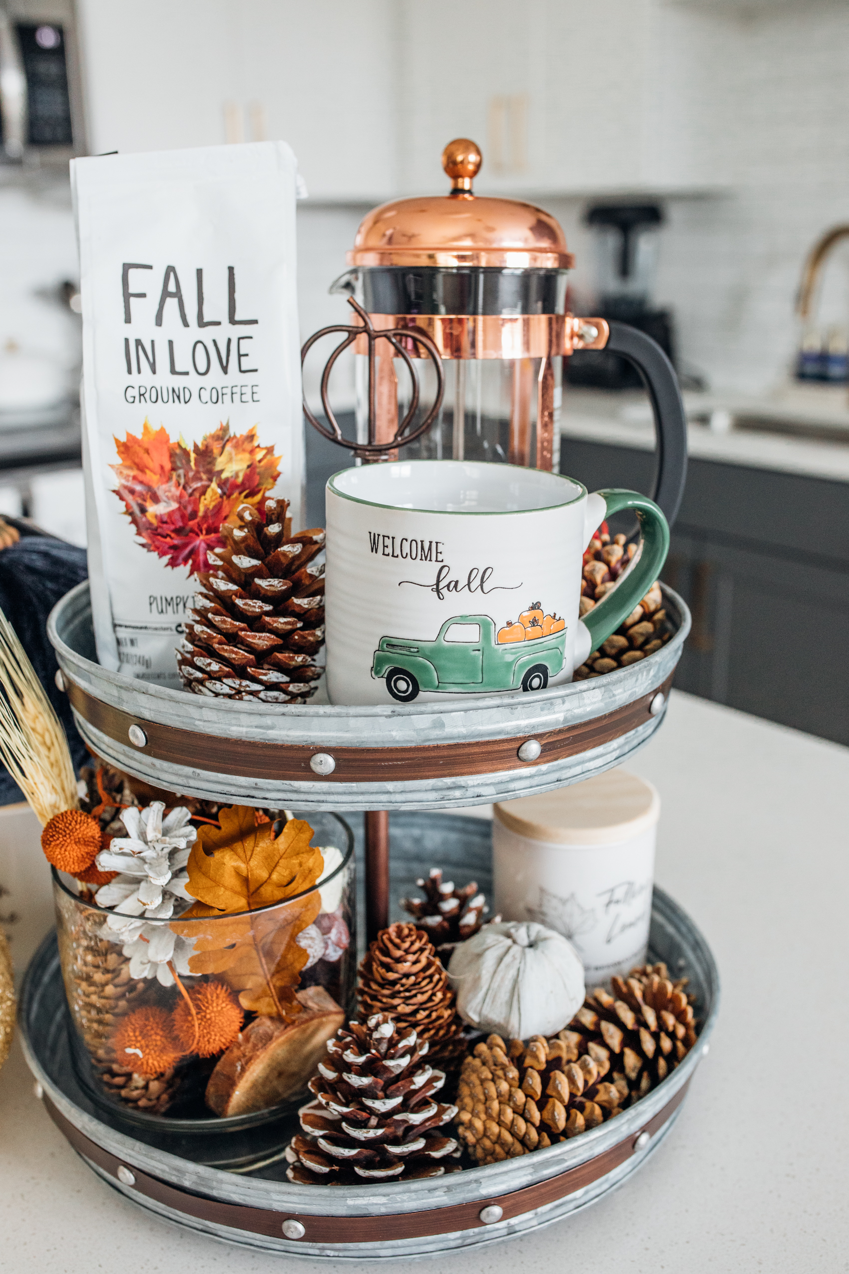 Fall kitchen decor centerpiece with pinecones and mugs