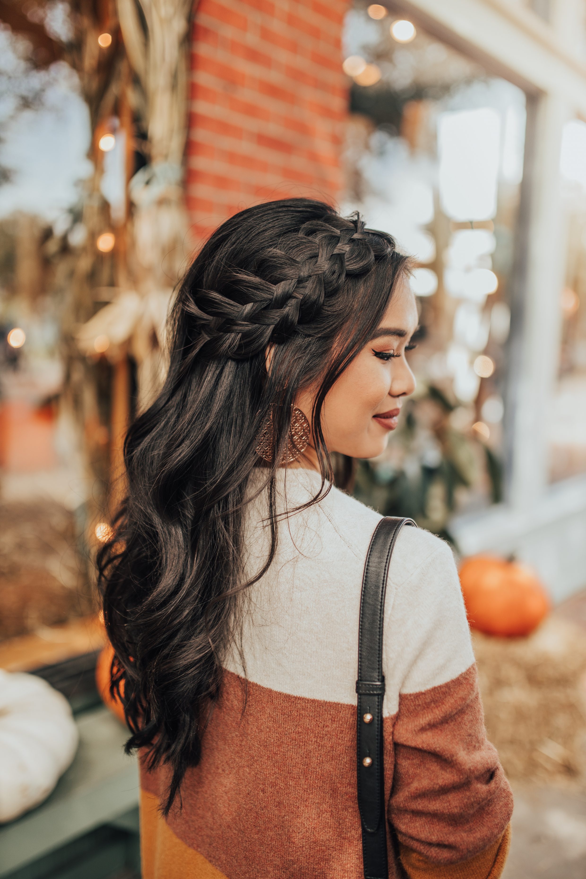 Striped cardigan and messy braids for fall on blogger Hoang-Kim