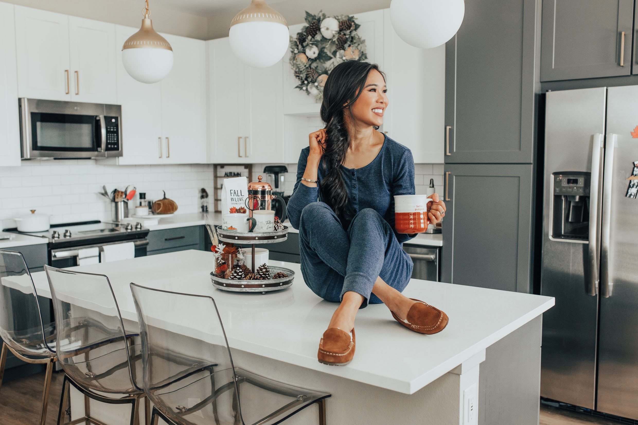 Comfy fall outfit for relaxing at home with blogger Hoang-Kim in her Dallas apartment with two toned cabinets and fall decor