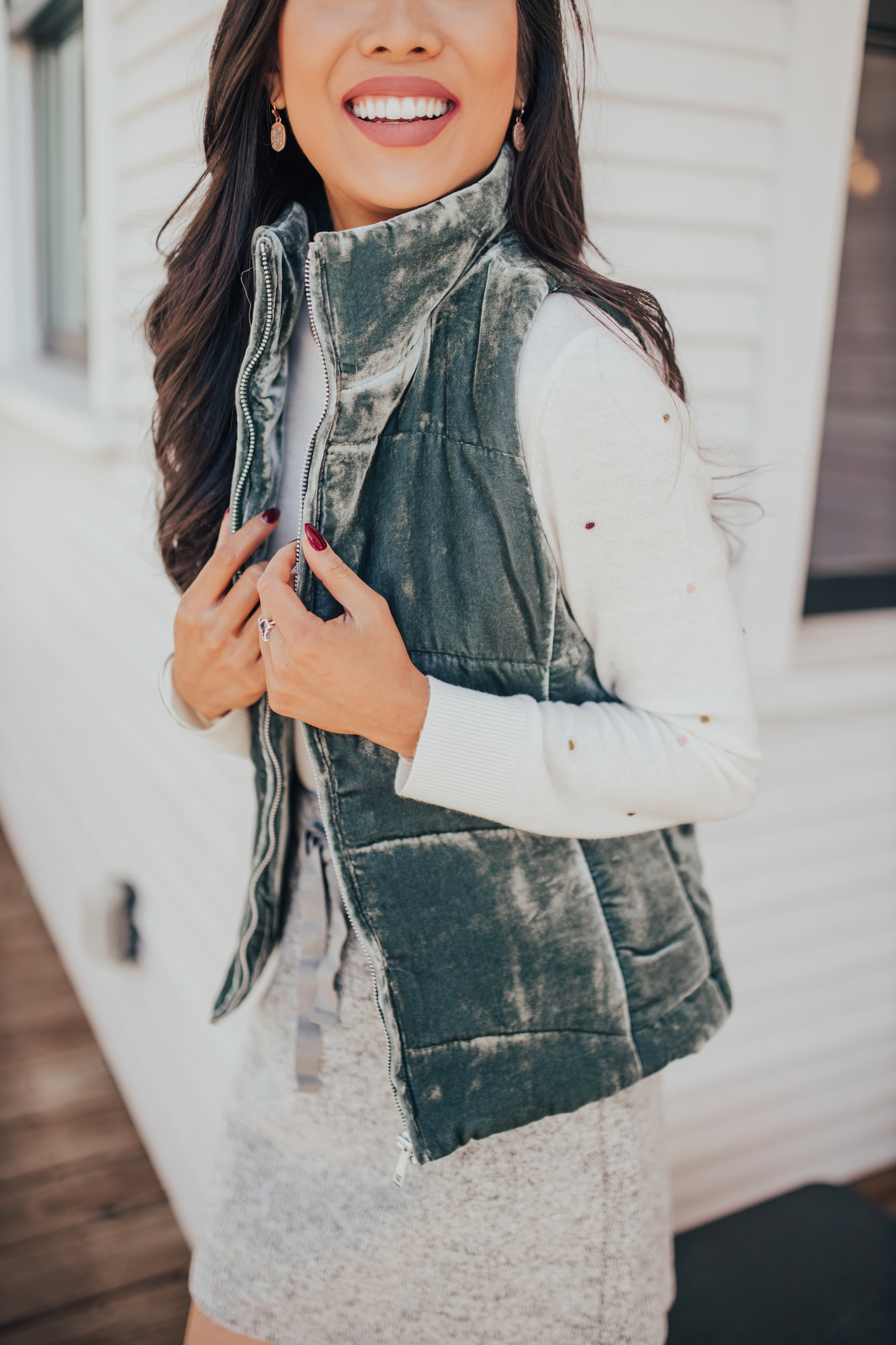 Velvet puffer vest outfit idea with a jogger skirt and bobblehead sweater on Dallas Blogger Hoang-Kim in Bishop Arts