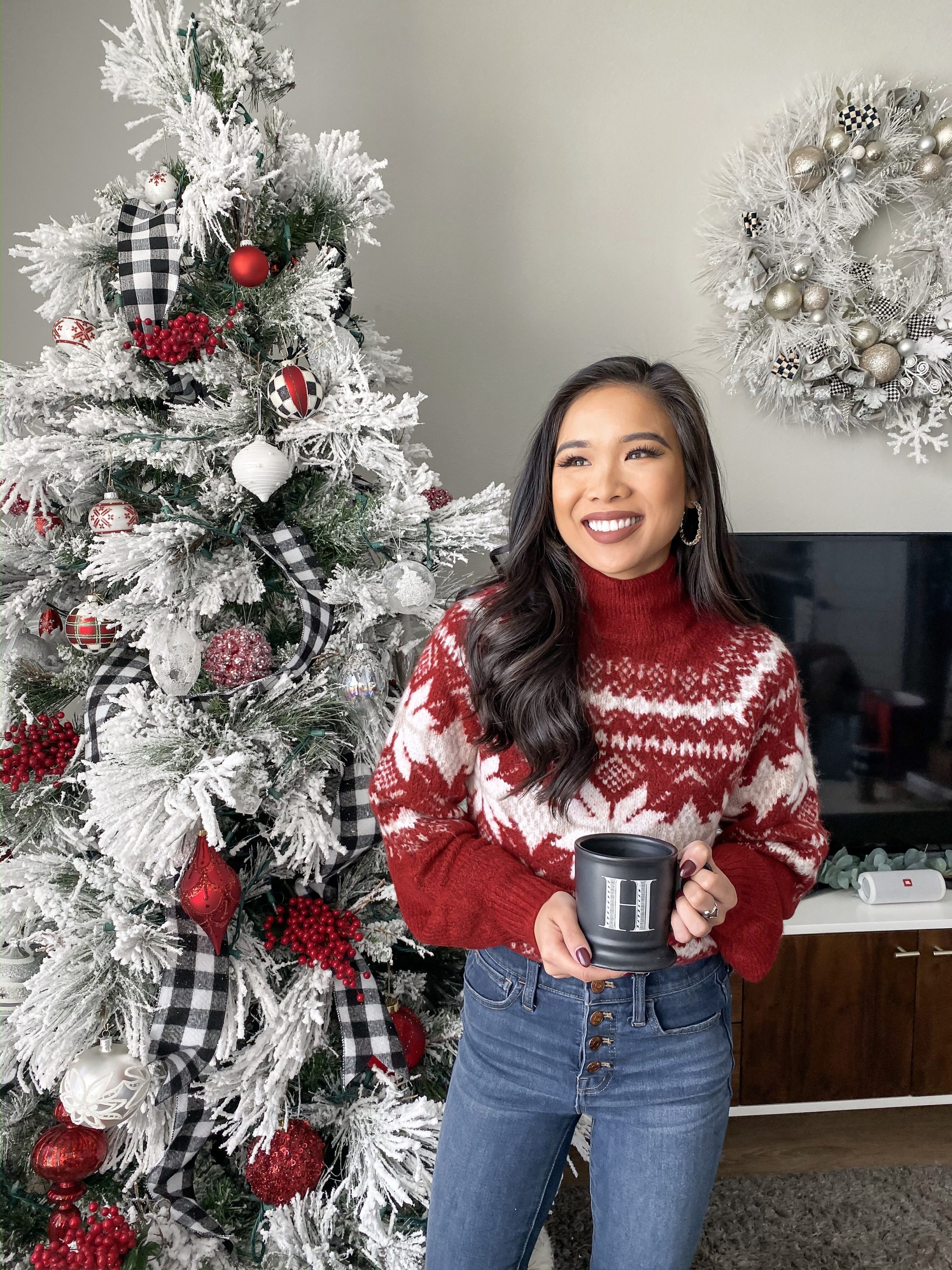 Cozy Christmas outfits with a fair isle sweater and flocked Christmas tree